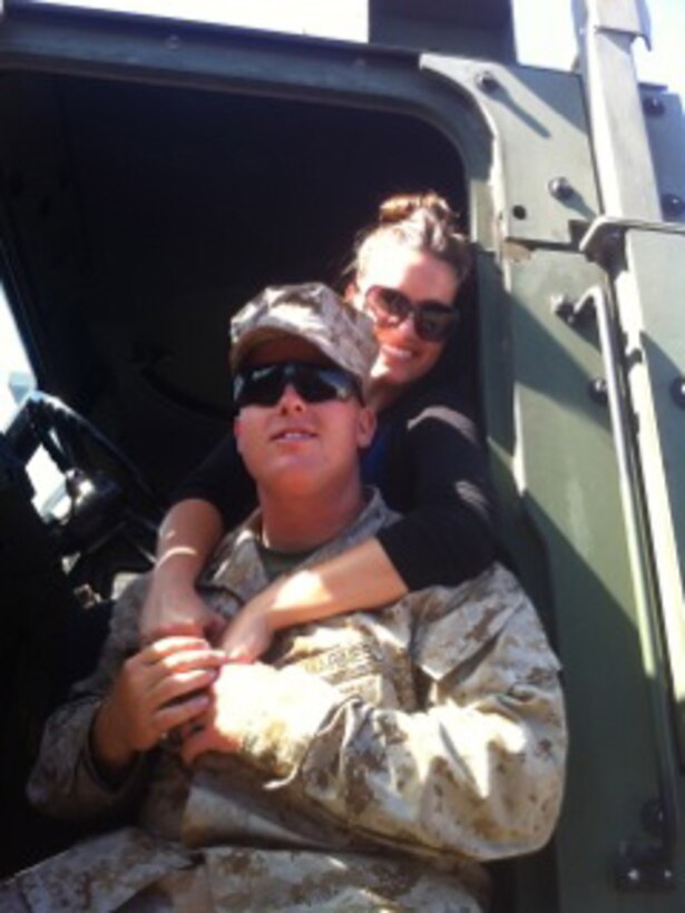 Cpl. Justin Peterson with Marine Air Support Squadron (MASS) 3 and Juliann Peterson, his wife, pose in a vehicle aboard Marine Corps Base Camp Pendleton, Calif. Juliann Peterson works to spread knowledge and support throughout MCB Camp Pendleton and MASS-3.