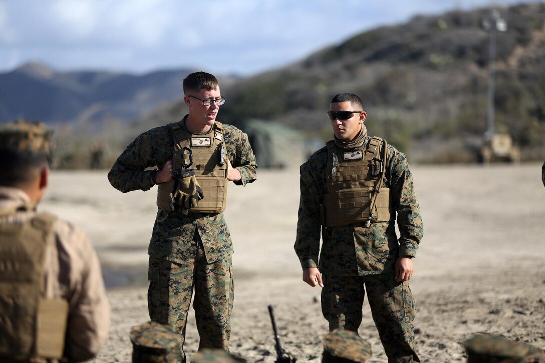 U.S. Marine Pfc Jonathan Harris from Bear, Del. (Left) and Lance Cpl Christopher DeCasanova of Camden, N.J. Combat Engineers with Bridge Company, 7th Engineer Support Battalion (ESB), 1st Marine Logistics Group provides a safety brief for Marines of Headquarters & Service Company, 3D Assault Amphibious Battalion, 1st Marine Division during training Dec. 4, 2013 aboard Camp Pendleton Calif. The Marines of 7th ESB conducted bridging operations on Red Beach to improve unit readiness.
