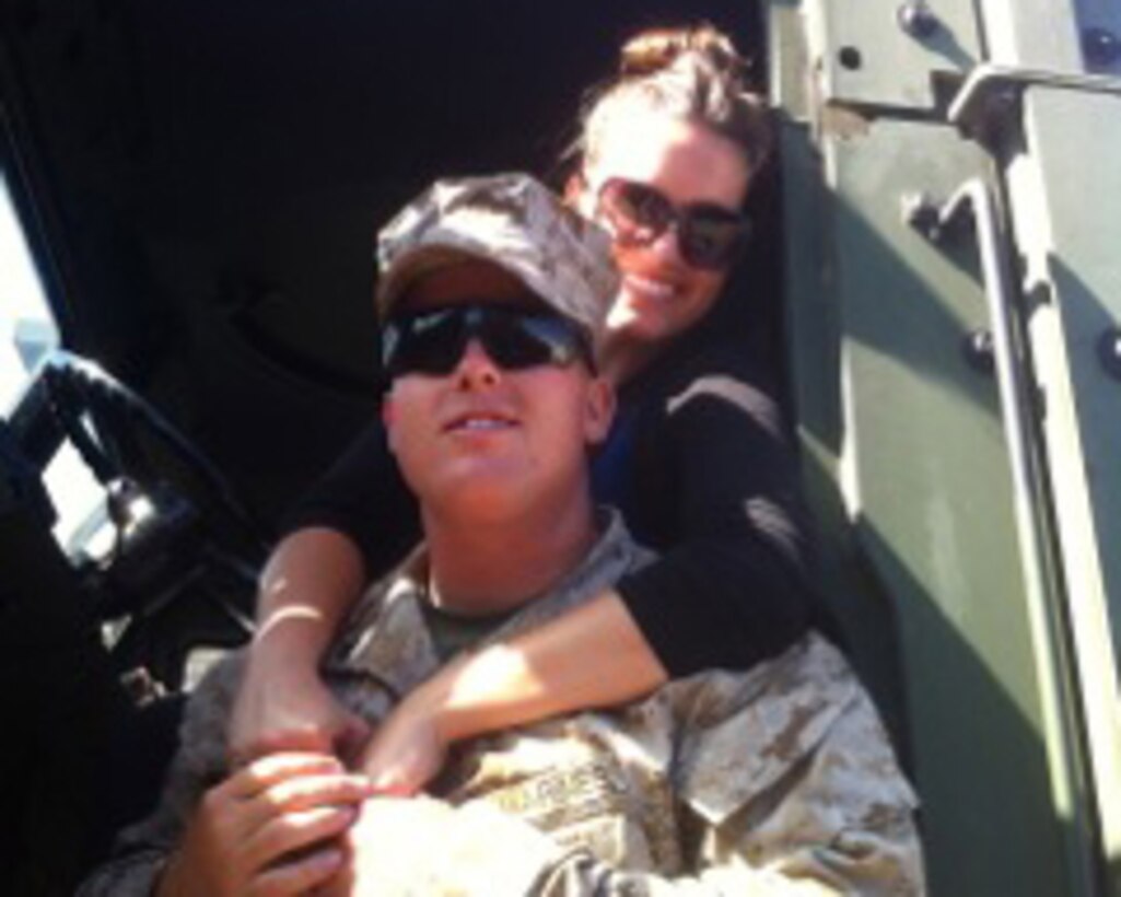 Cpl. Justin Peterson with Marine Air Support Squadron (MASS) 3 and Juliann Peterson, his wife, pose in a wehicle aboard Marine Corps Base Camp Pendleton, Calif. Juliann works to spread knowledge and support throughout MCB Camp Pendleton and MASS-3.