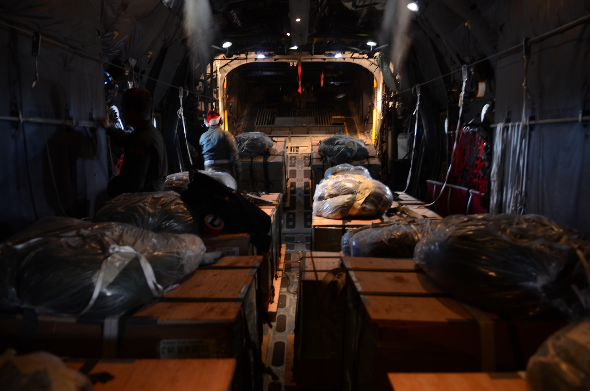 C- 130 Hercules aircrew members of the 36th Airlift Squadron from Yakota Air Base, Japan, prepare for takeoff on Andersen Air Force Base, Guam, before an Operation Christmas Drop mission Dec. 11, 2013. Every December, C-130 Hercules aircrews from the 374th Airlift Wing at Yokota AB partner with the 36th Wing at Andersen AFB to airlift food, supplies and toys to islanders throughout Micronesia. (U.S. Air Force photo by Senior Airman Marianique Santos/Released)