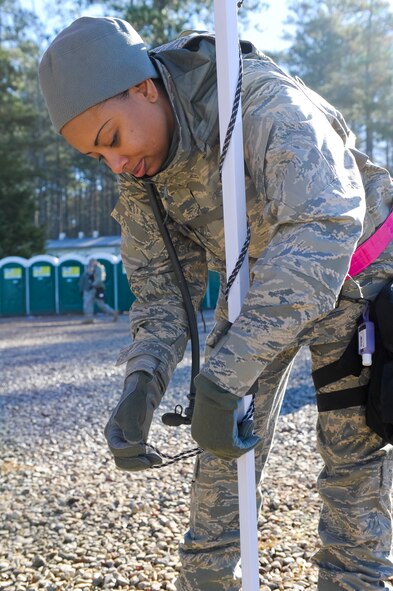 U.S. Air Force Tech. Sgt. Natalie Hoskins, 116th Medical Group, Georgia Air National Guard, sets up a tent during the Region 4 Homeland Response Force (HRF) external evaluation at Pelham Range, Anniston, Ala., Dec. 11, 2013. The medical group from the 116th Air Control Wing, stationed at Robins Air Force Base, Ga., is a key component of the Region 4 HRF whose mission is to respond during disasters in the Southeast U.S. region. During the evaluation, the task force comprised of Air and Army National Guardsmen, responded to various scenarios that tested their ability to save lives and mitigate suffering in order to ensure their preparedness in the event of an incident or catastrophic event. (U.S. Air National Guard photo by Master Sgt. Roger Parsons/Released)

