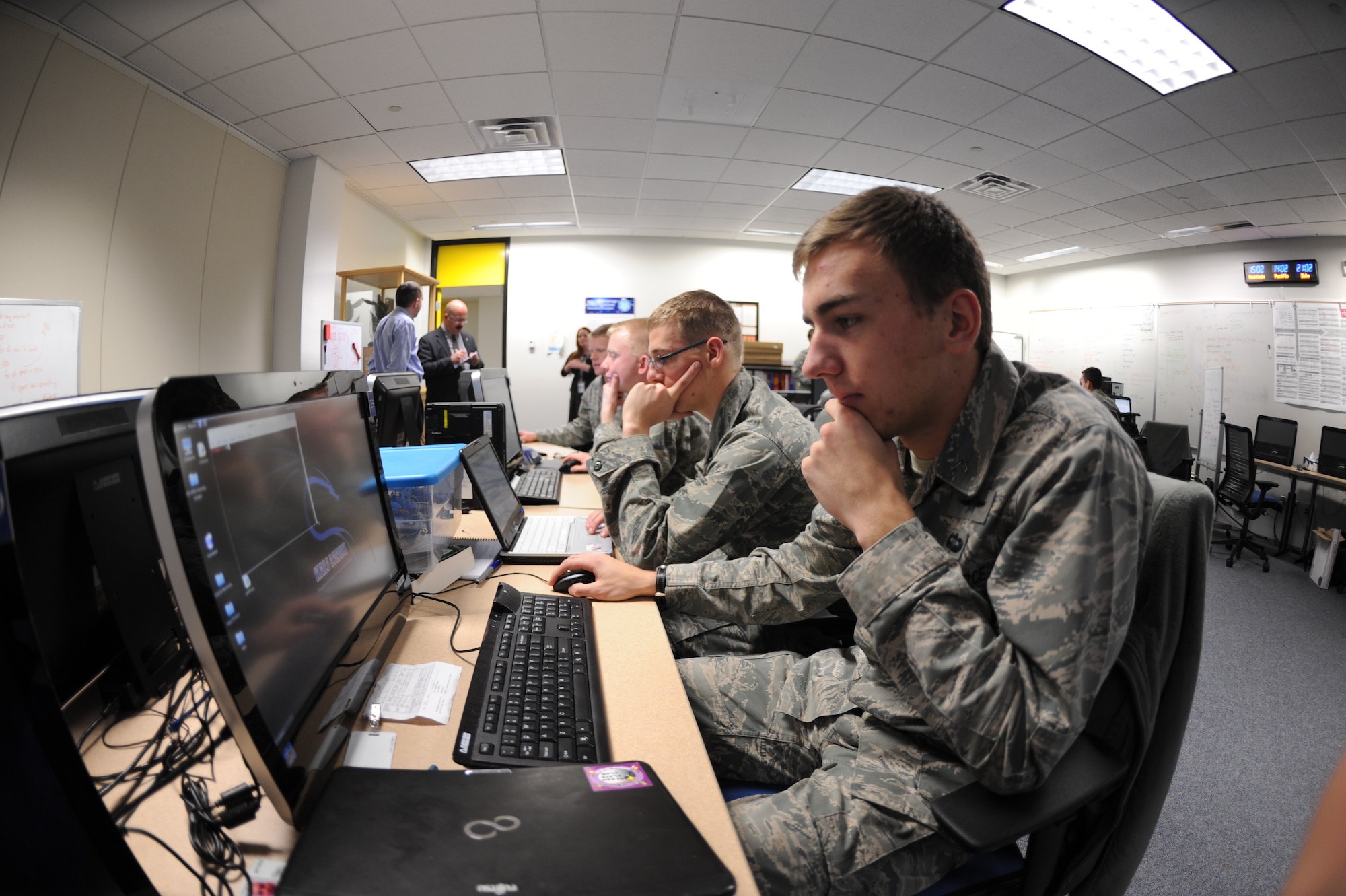 Members of the Academy Cyber Competition team run through scenarios in
preparation for an upcoming competition Dec. 10. (U.S. Air Force Photo/John Van Winkle)  