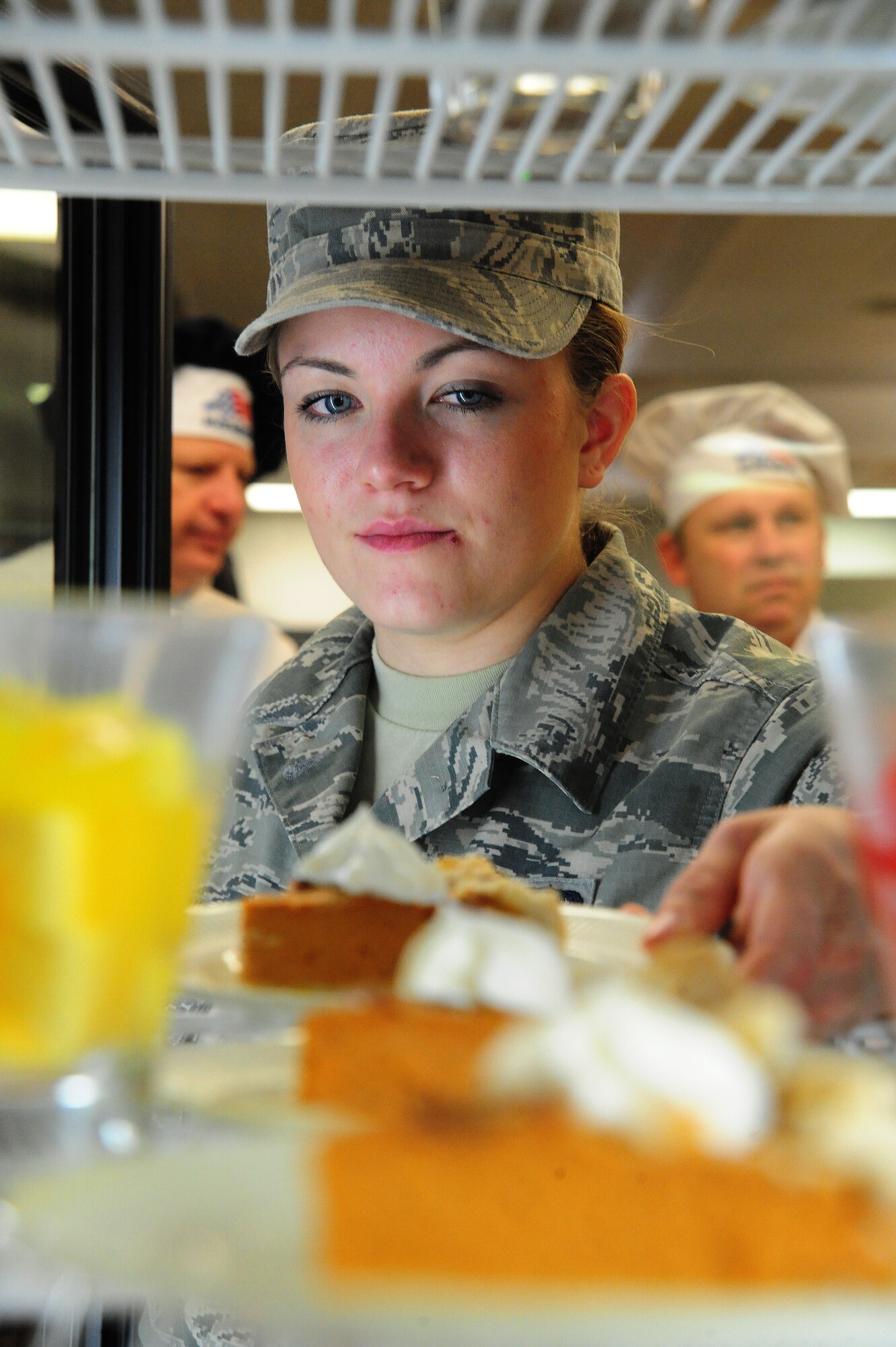 U.S. Air Force Airman 1st Class Amy Klavitzer, 509th Force Support Squadron food service apprentice, arranges slices of pumpkin pie for customers during a Thanksgiving luncheon at the Ozark Inn on Whiteman Air Force Base, Mo., Nov. 28, 2013. The Ozark Inn staff along with several members of wing leadership served up a home-cooked Thanksgiving meal for Airmen and their families. (U.S. Air Force photo by Staff Sgt. Nick Wilson/Released)