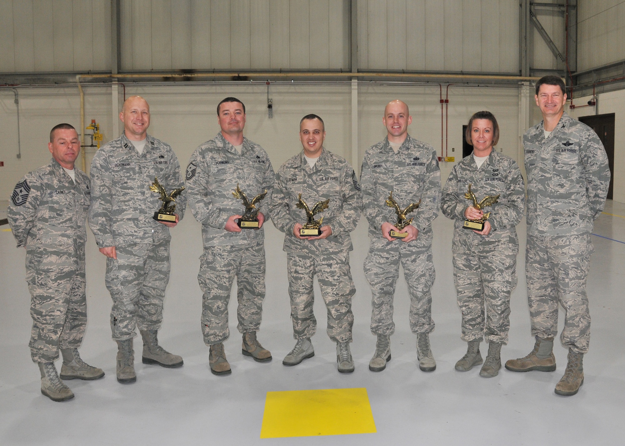 131st Bomb Wing commander Col Mike Francis and wing command Chief Master Sgt. Paul Carney stand with the 131st Airman of the Year winners.  Pictured (center l to r):  Capt. Daniel Uchtmann, Master Sgt. Frank Pliemling, Senior Master Sgt. Nicholas Eyman, Staff Sgt. Tyler Owenby. Senior Airman Ashlea Garrison  (U.S. Air National Guard photo by Senior Master Sgt. Mary-Dale Amison)