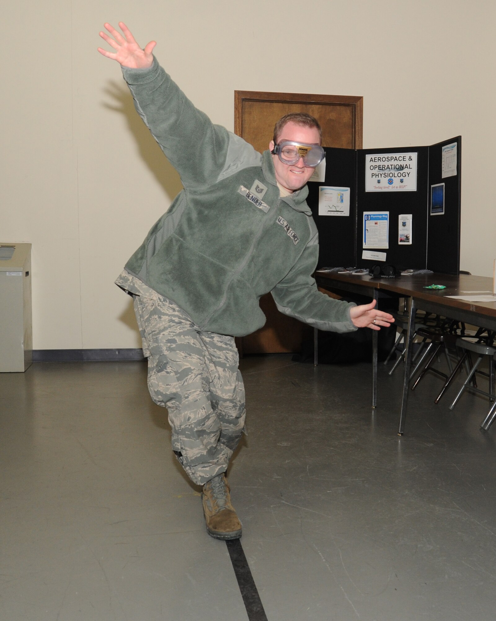 Tech. Sgt. Brian Bender, 92nd Air Refueling Wing Public Affairs NCO in charge, walks the line at the Driving Under the Influence fair Dec. 6, 2013, at Fairchild Air Force Base, Wash. The DUI fair is an annual event held to educate people on the effects of drinking and driving. (U.S. Air Force photo by Sam Fogelman/Released)