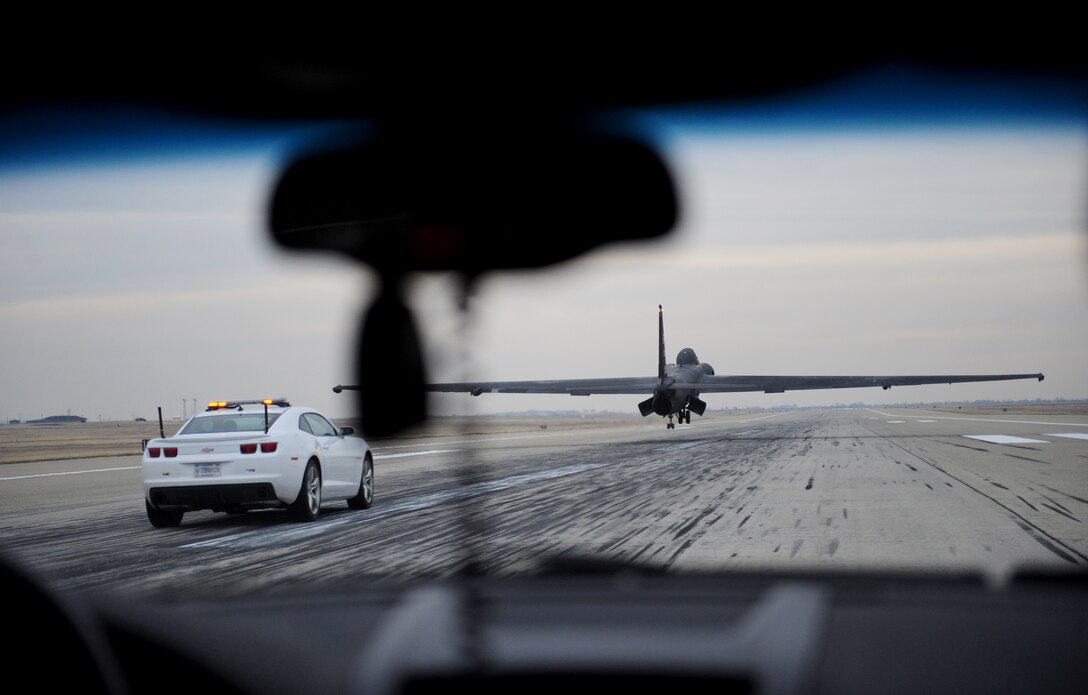 Col. Phil Stewart, 9th Reconnaissance Wing commander, pursues a U-2 Dragon Lady in a mobile chase car at Beale Air Force Base, Calif., Dec. 6, 2013. Stewart was escorting retired NASA astronaut Robert Gibson who was serving as a guest speaker at the wing holiday party. (U.S. Air Force photo by Airman 1st Class Bobby Cummings/Released)