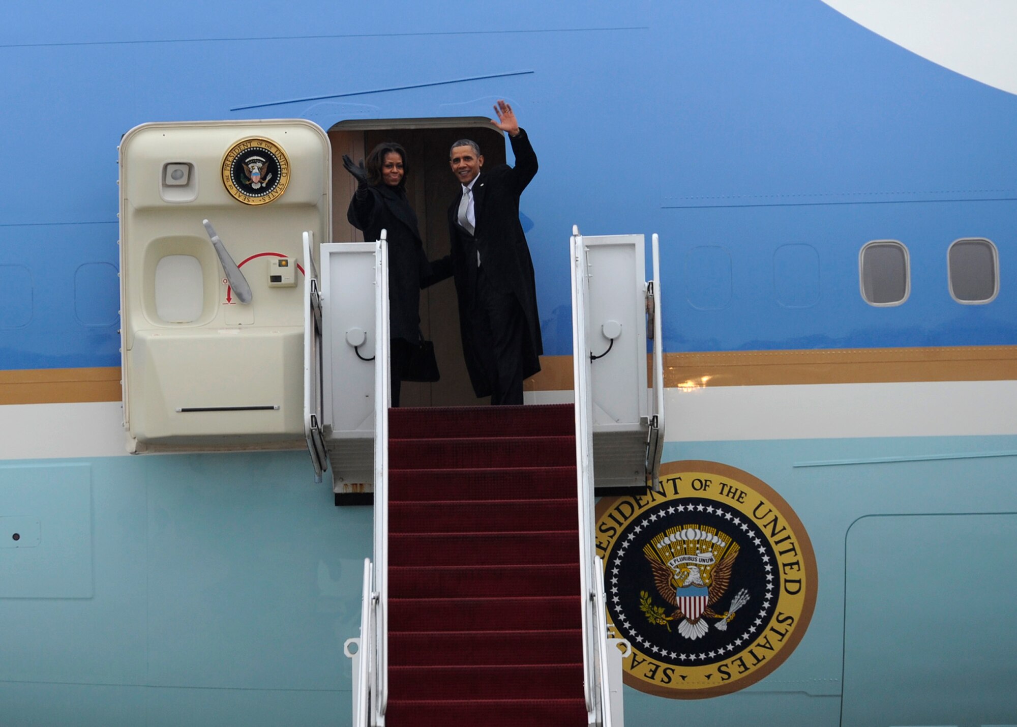 President Barack Obama and First Lady Michelle prepare to depart Joint Base Andrews, Md., for Johannesburg, South Africa to attend a national memorial service for former South African President and anti-apartheid icon, Nelson Mandela on Dec. 9, 2013. Former President George W. Bush along, with former First Ladies Laura Bush and Hilary Clinton will be accompanying the first couple during the trip. (U.S. Air Force photo/ Airman 1st Class Nesha Humes)