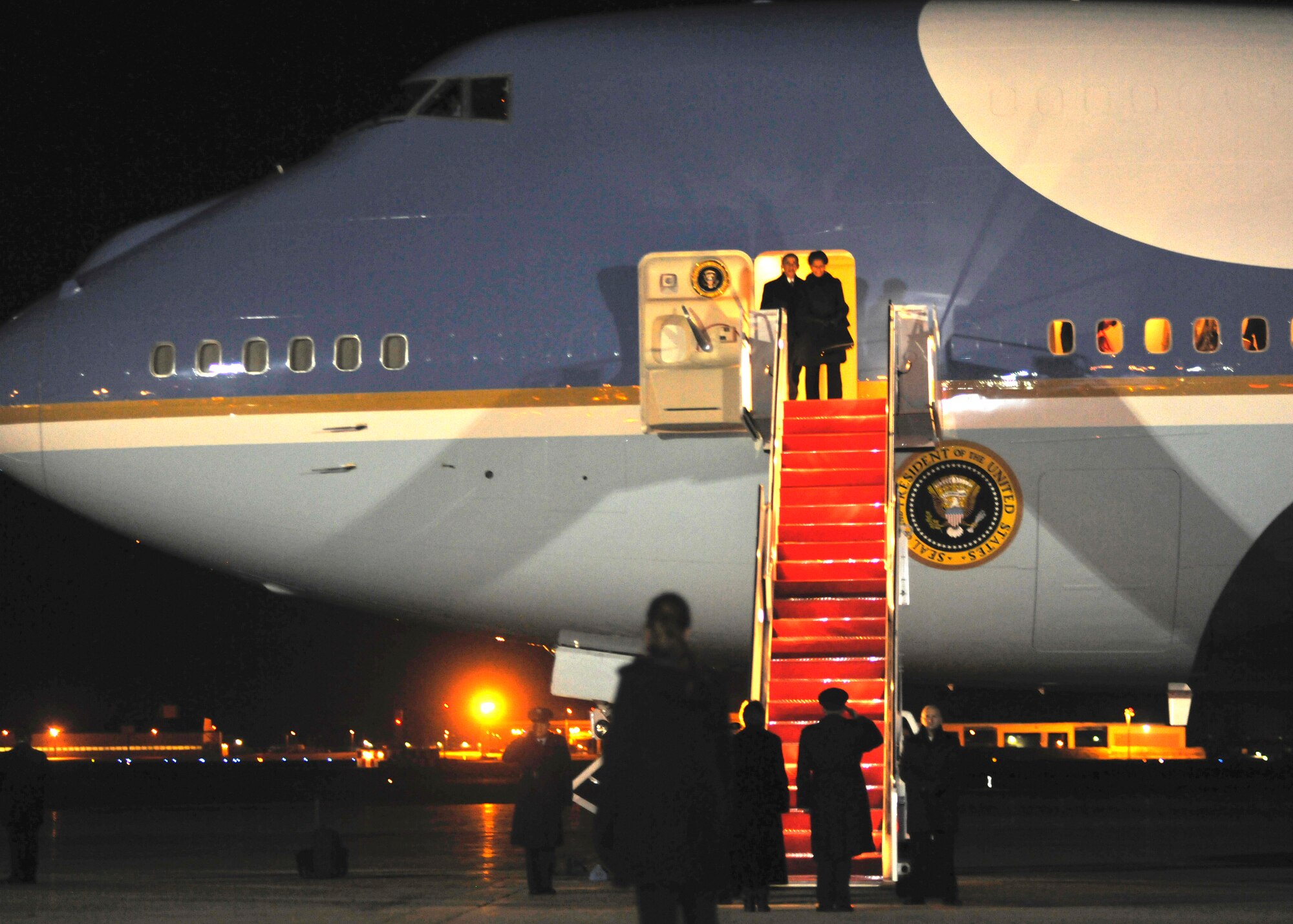 President Barack Obama and First Lady Michelle Obama arrive at Joint Base Andrews on Dec. 11, 2013 after attending memorial services for former South African President, Dr. Nelson Mandela. Mandela served as South Africa’s president from 1994 to 1999. (U.S. Air Force photo/Senior Airman Lindsey A. Porter)