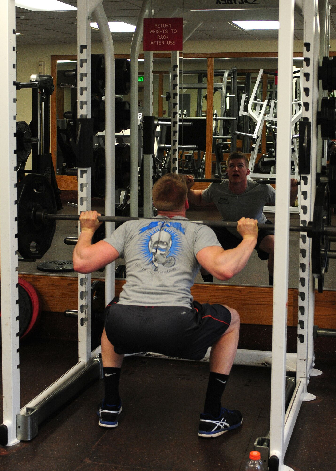 Airman 1st Class Justin, 427th Reconnaissance Squadron, warms up for the Beale’s Best competition at the Harris Fitness Center Dec. 10, 2013. The Beale's Best Fitness Competition is held once a quarter. During the week-long competition members of Team Beale can ask to be validated by a Harris Fitness Center staff member for the bench press and squat categories. (U.S. Air Force photo by Senior Airman Allen Pollard/Released)
