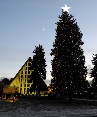 The base Christmas tree was lit Dec. 6, 2013, at Fairchild Air Force Base, Wash., during the annual tree-lighting ceremony. The ceremony also included a singing performance from children from the Michael Andersen Elementary School and a visit from Santa. (U.S. Air Force photo by Ryan Zeski/Released)
