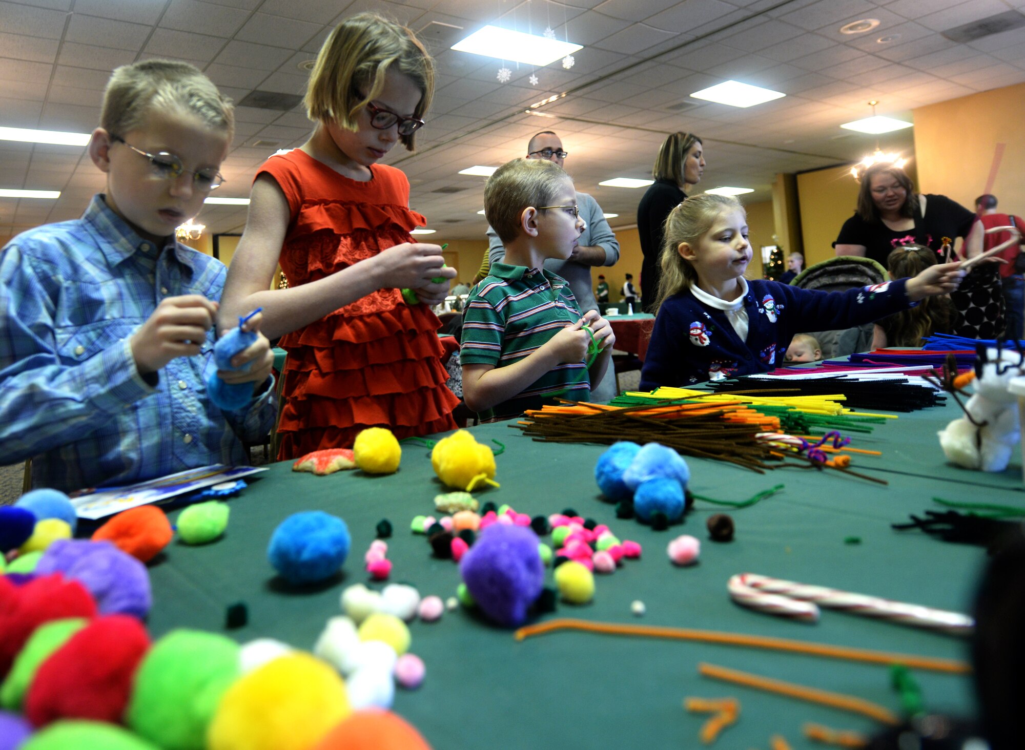 Children enjoy arts and crafts during the Breakfast with Santa event in the Dakota’s Club at Ellsworth Air Force Base, S.D., Dec. 7, 2013. The event was designed to foster the Christmas spirit and bring families together during the holiday season. (U.S. Air Force photo by Senior Airman Zachary Hada/Released)