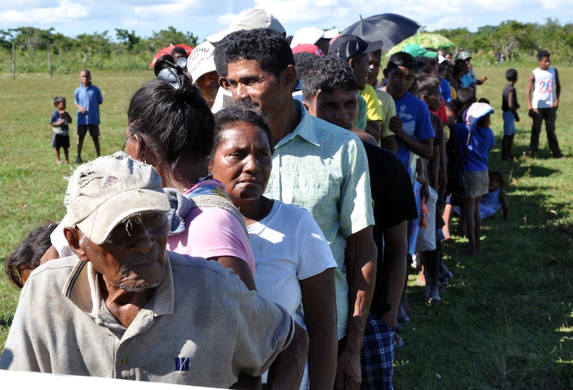 Honduran citizens wait in line to for medical treatment during a Medical Readiness Training Exercise (MEDRETE) conducted by Joint Task Force-Bravo in the Department of Gracias a Dios, Honduras, Dec. 4, 2013.  Joint Task Force-Bravo routinely partners with the Honduran Ministry of Health and the Honduran military to perform these humanitarian aid missions to provide medical care to the most isolated regions of the country. (U.S. Air Force photo by Capt. Zach Anderson)