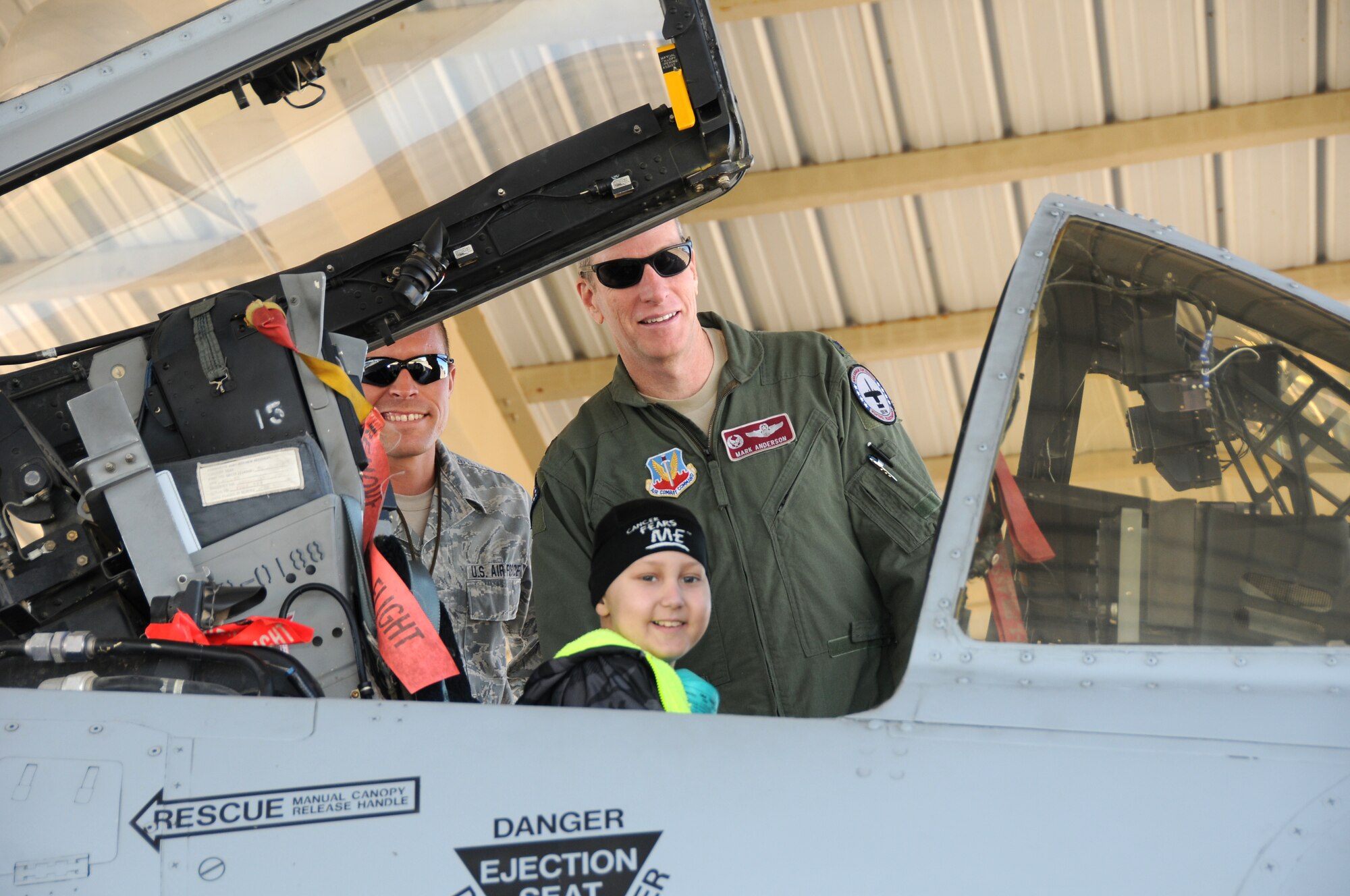 Tech. Sgt. Orion Stell, a crew chief with the 188th Aircraft Maintenance Squadron, and Col. Mark Anderson, 188th Fighter Wing commander, give pilot for a day Skyler Leroy an orientation to the A-10C Thunderbolt II "Warthog" during his visit to the 188th. (U.S. Air National Guard photo by Senior Airman John Hillier/188th Fighter Wing Public Affairs)