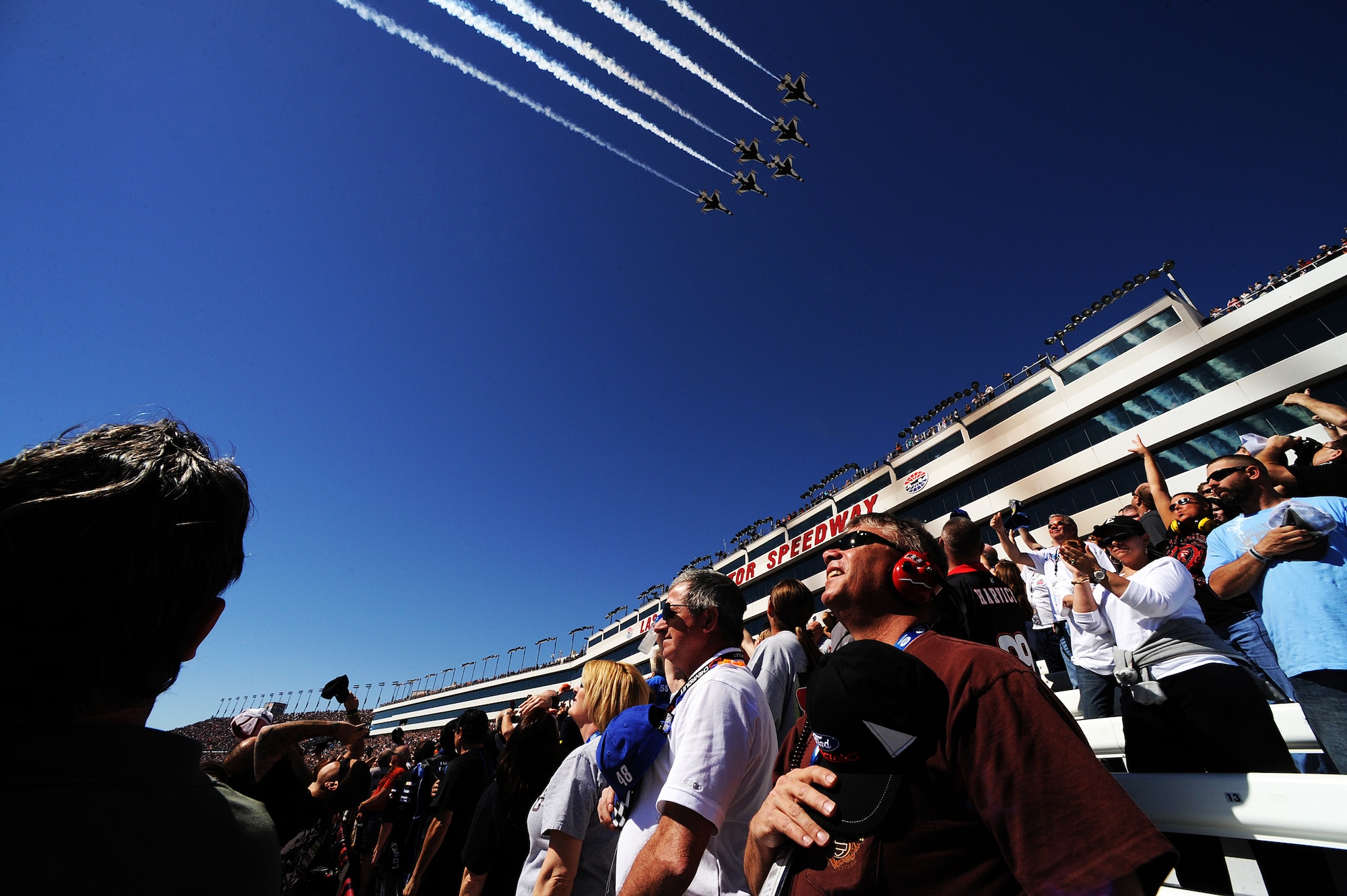 The U.S. Air Force Thunderbirds fly the six-ship Delta formation over the Las Vegas Motor Speedway to begin the start of the Kobalt Tools 400 March 10, 2013, Las Vegas.  The squadron will kick off its 2014 show schedule at the Daytona International Speedway in Daytona Beach, Fla., Feb. 23.
(U.S. Air Force photo/Staff Sgt. Larry E. Reid Jr., Released)
