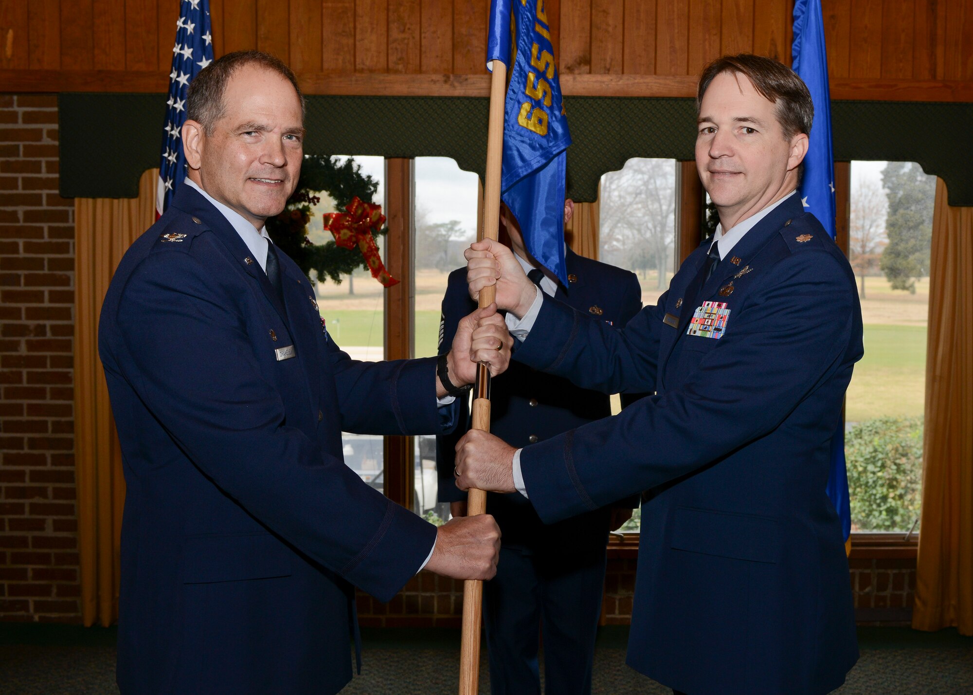 U.S. Air Force Lt. Col. Brian Mueller assumed command of the 42nd Intelligence Squadron from Col. Douglas Drakeley, 655th Intelligence, Surveillance and Reconnaissance Group commander, during an activation and assumption of command ceremony at the Eaglewood Golf Course at Langley Air Force Base, Va., Dec. 7, 2013. The 42nd IS mission is to support current operations and contingency planning by providing targeting-focused products. (U.S. Air Force photo by Senior Airman Connor Estes/Released)