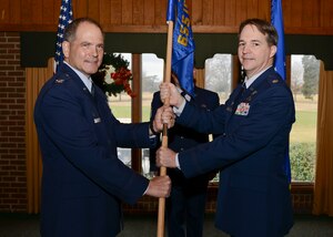 U.S. Air Force Lt. Col. Brian Mueller assumed command of the 42nd Intelligence Squadron from Col. Douglas Drakeley, 655th Intelligence, Surveillance and Reconnaissance Group commander, during an activation and assumption of command ceremony at the Eaglewood Golf Course at Langley Air Force Base, Va., Dec. 7, 2013. The 42nd IS mission is to support current operations and contingency planning by providing targeting-focused products. (U.S. Air Force photo by Senior Airman Connor Estes/Released)