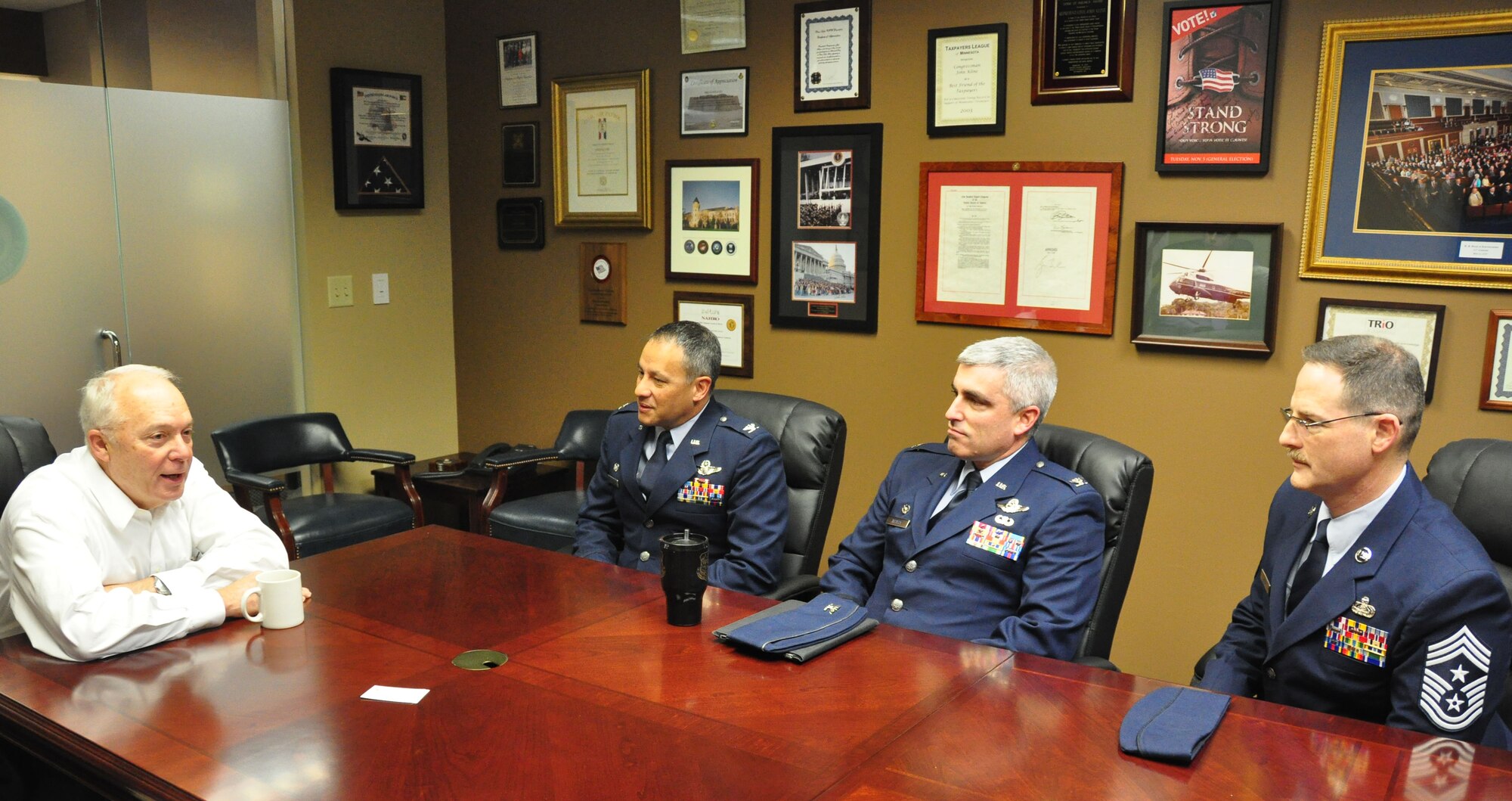 Congressman John Kline, Minn. 2nd District, talks with Col. Todd McCubbin, 934th Airlift Wing commander, Col. Keith Wesley, 934th Operations Group commander, and Command Chief Master Sgt. Bryan Payne Dec. 9.  The visit was part of the 934th Airlift Wing Public Affairs congressional relations program. (Air Force Photo/Paul Zadach)