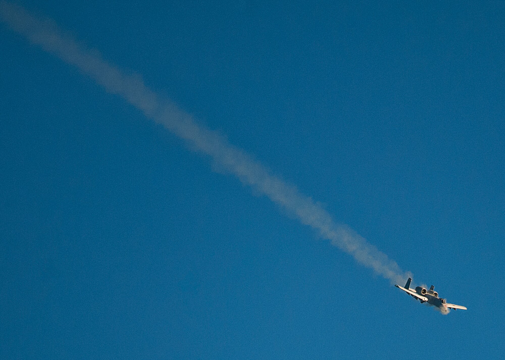An A-10 Thunderbolt II, from the 40th Flight Test Squadron, fires the GAU-8 30mm cannon during a training mission on the Eglin Air Force Base, Fla., range Dec. 10.  The pilot made multiple passes to fire the weapon and completed two strafing runs during the afternoon sortie.  (U.S. Air Force photo/Samuel King Jr.)