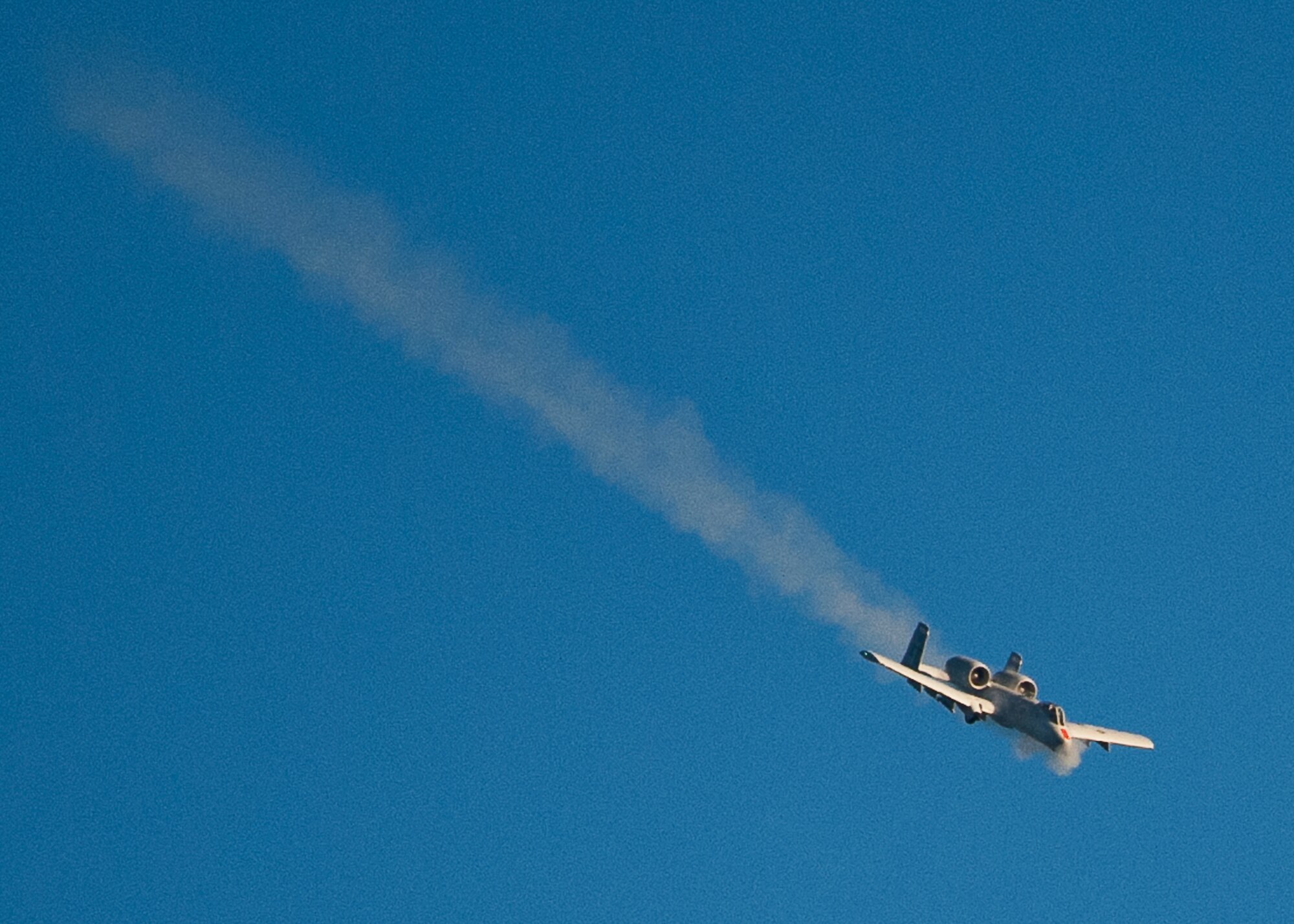 An A-10 Thunderbolt II, from the 40th Flight Test Squadron, fires the GAU-8 30mm cannon during a training mission on the Eglin Air Force Base, Fla., range Dec. 10.  The pilot made multiple passes to fire the weapon and completed two strafing runs during the afternoon sortie.  (U.S. Air Force photo/Samuel King Jr.)