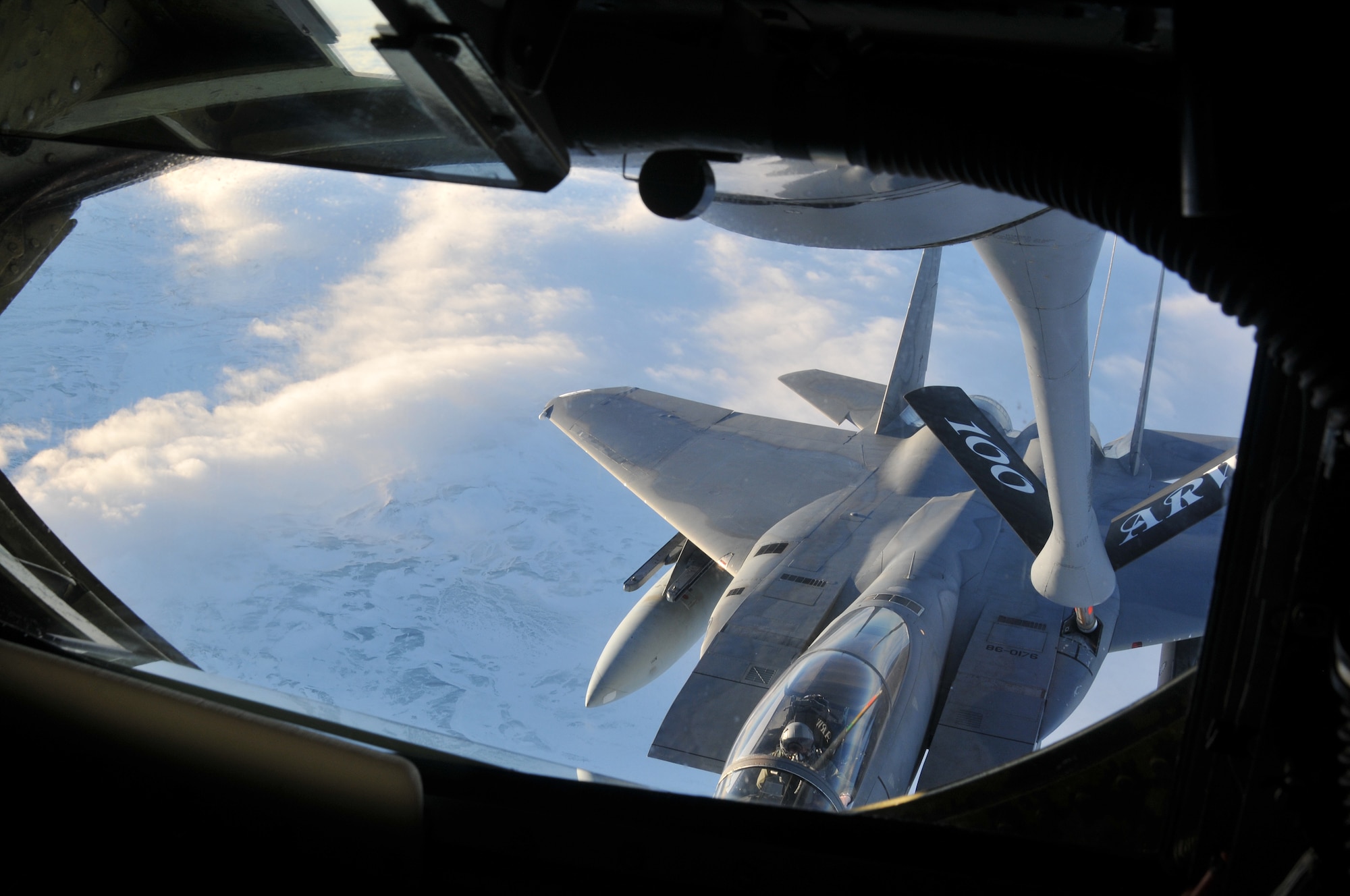 A  KC-135 Stratotanker crew refuels an F-15C Eagle over Iceland during a training mission Nov. 21, 2013. The 48th Air Expeditionary Group maintained the NATO air surveillance and policing mission in Iceland from Oct. 28 to Nov. 29. (U.S. Air Force photo by 1st Lt. Leah Davis/Released)