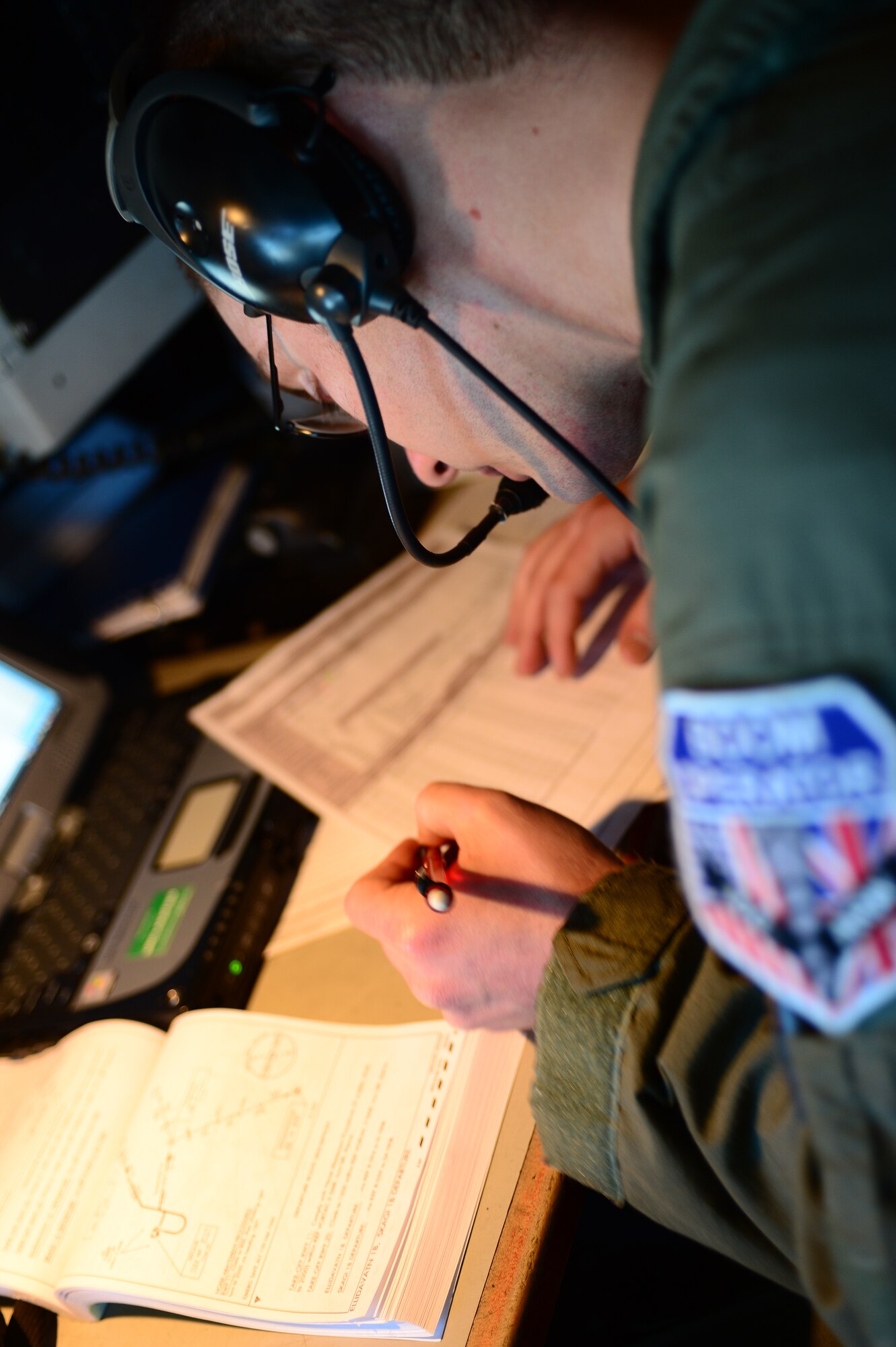 Senior Airman Andrew Parsons, 351st Expeditionary Air Refueling Squadron boom operator, fills out paperwork prior to a flight while deployed to Iceland Nov. 19, 2013. The 48th Air Expeditionary Group maintained the NATO air surveillance and policing mission in Iceland from Oct. 28 to Nov. 29. (U.S. Air Force photo by Airman 1st Class Dana J. Butler/Released)