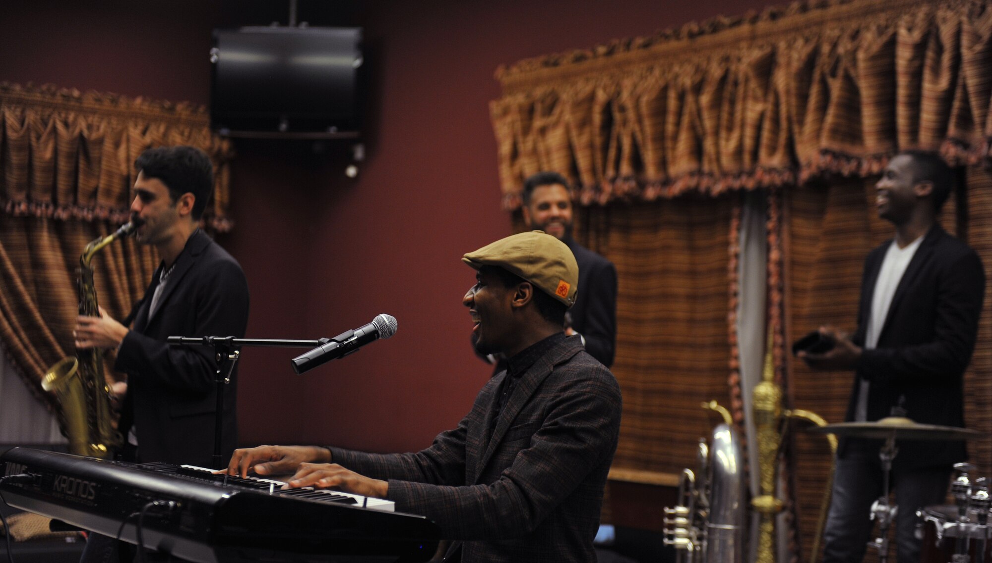 Jonathan Batiste and the Stay Human Band perform for service members at the 379th Air Expeditionary Wing, Southwest Asia, on Dec. 8, 2013. The band played modern jazz at the Kasbah which is one of the entertainment venues here. (U.S. Air Force photo/Master Sgt. David Miller)
