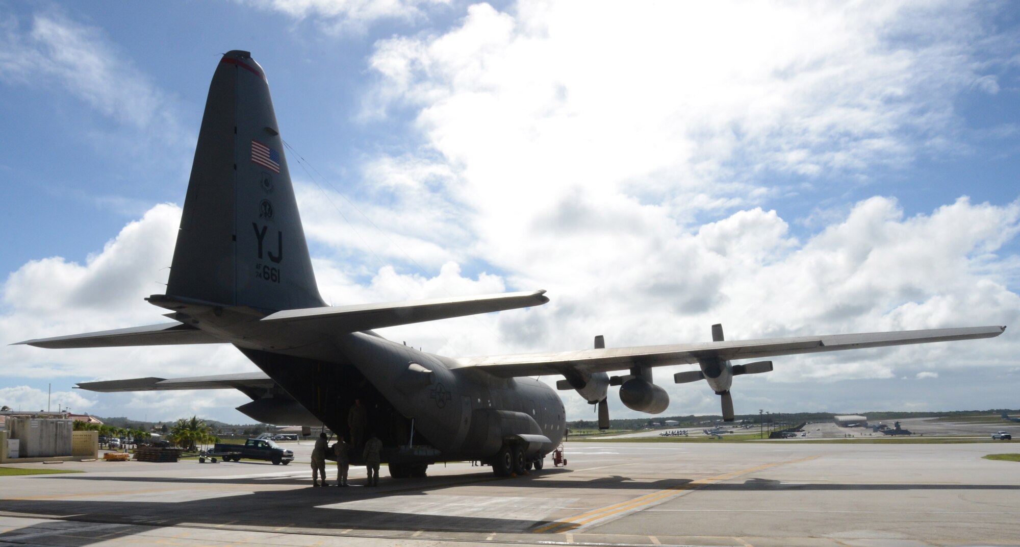 A C-130 Hercules is parked prior to being loaded with 300 pound low-cost, low-altitude airdrop bundles for Operation Christmas Drop, Dec. 9, 2013 on Andersen Air Force Base, Guam. Every December, C-130 Hercules crews from the 374th Airlift Wing at Yokota Air Base, Japan, partner with the 36th Wing at Andersen Air Force Base, Guam, to airlift food, supplies and toys to islanders throughout Micronesia. (U.S. Air Force photo by Airman 1st Class Emily A. Bradley/Released)