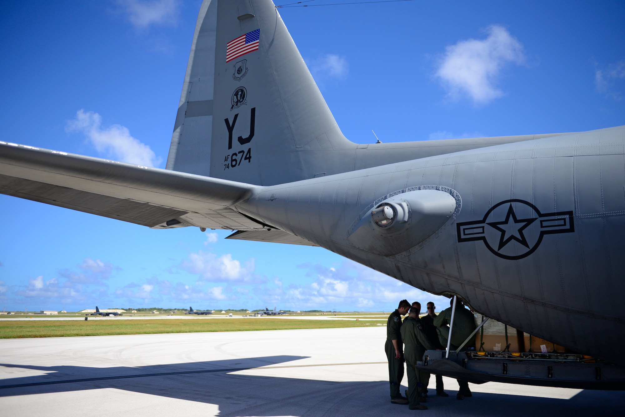 Members of the 36th Airlift Squadron, Yokota Air Base, Japan, conduct a pre-flight mission brief before an airdrop mission at Andersen Air Force Base, Guam, during Operation Christmas Drop, Dec. 10, 2013. This year marks the 62nd year of Operation Christmas Drop, which began in 1952, making it the world's longest running airdrop mission. Every December, C-130 Hercules crews from the 374th Airlift Wing at Yokota Air Base, Japan, partner with the 36th Wing at Andersen Air Force Base, Guam, to airlift food, supplies and toys to islanders throughout Micronesia. (U.S. Air Force photo by 2nd Lt. Jake Bailey/Released)