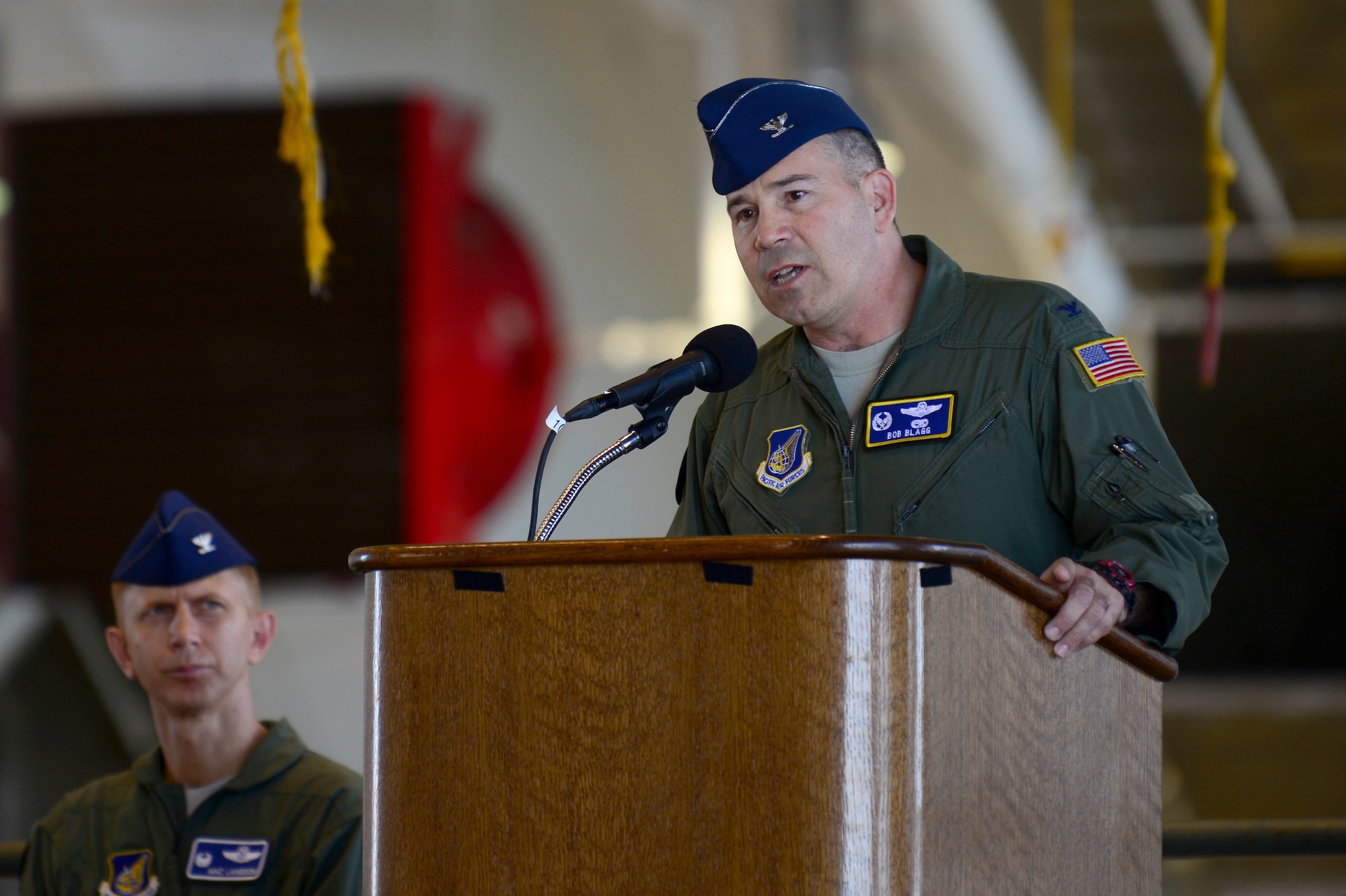 Col. Bob Blagg, 374th Operations Group commander delivers opening remarks during the opening ceremony for Operation Christmas Drop at Andersen Air Force Base, Guam, Dec. 10, 2013. This year marks the 62nd year of Operation Christmas Drop, which began in 1952, making it the world's longest running airdrop mission. Every December, C-130 Hercules crews from the 374th Airlift Wing at Yokota Air Base, Japan, partner with the 36th Wing at Andersen Air Force Base, Guam, to airlift food, supplies and toys to islanders throughout Micronesia. (U.S. Air Force photo by 2nd Lt. Jake Bailey/Released)