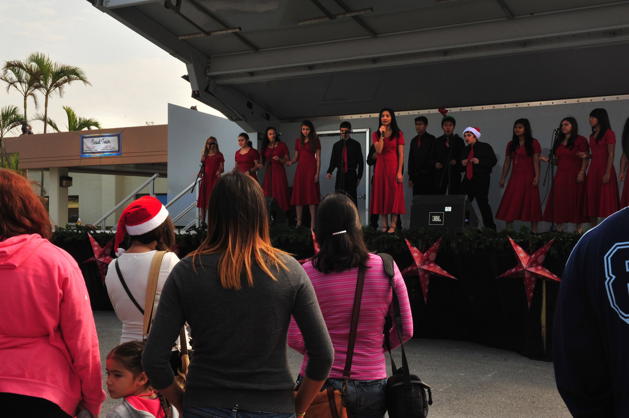 The Kadena Middle School Choir performs during Tinsel Town, Kadena Air Base, Japan, Dec. 7, 2013. Tinsel Town is an annual holiday celebration on Kadena with food, live music and a street fair. (U.S. Air Force photo by Staff Sgt. Rachelle Coleman)