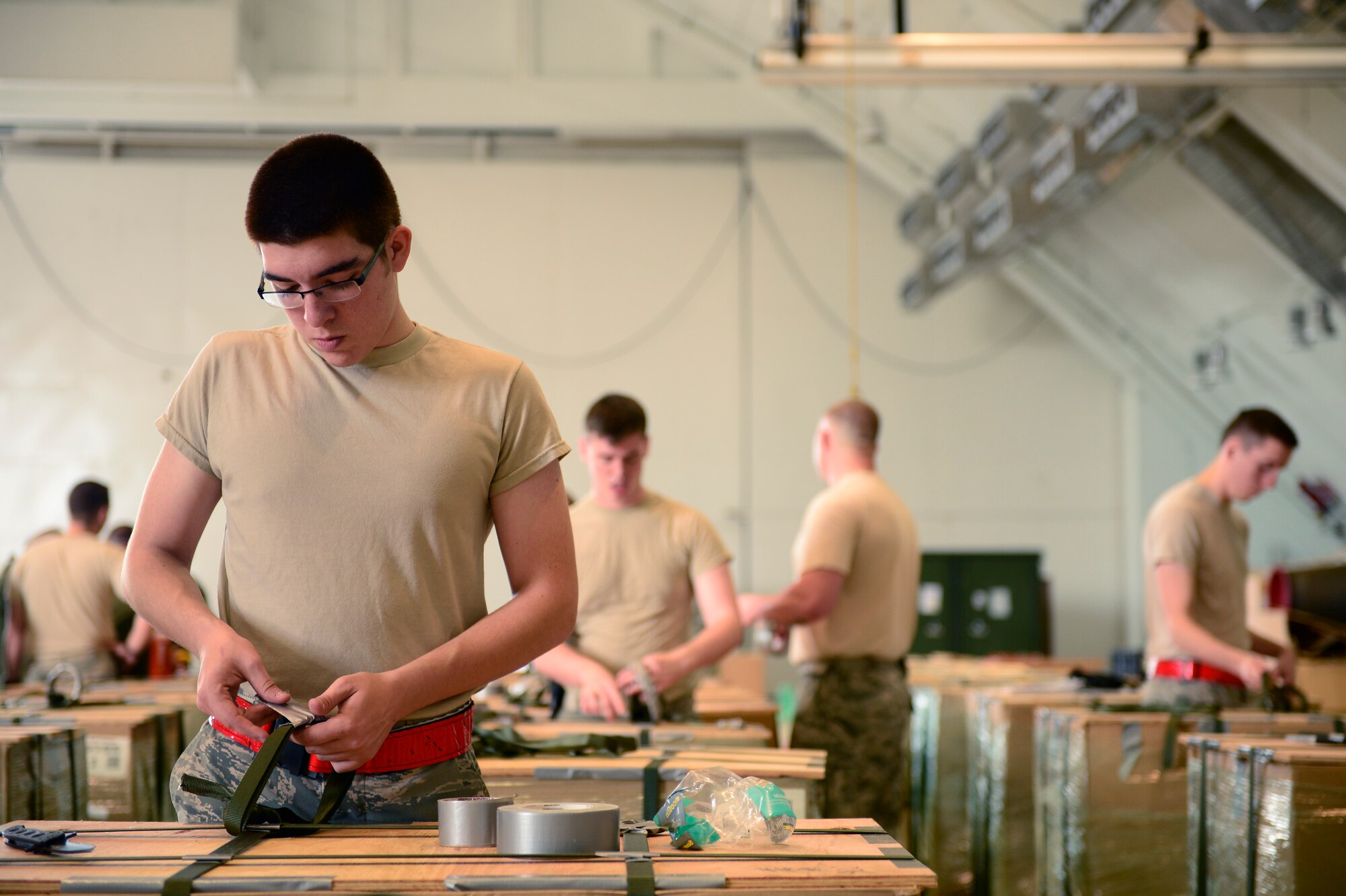 Capt. Olin Johnson, 36th Airlift Squadron, briefs fellow aircrew members at Andersen Air Force Base, Guam, during Operation Christmas Drop, Dec. 9, 2013. This year marks the 62nd year of Operation Christmas Drop, which began in 1952, making it the world's longest running airdrop mission. Every December, C-130 Hercules crews from the 374th Airlift Wing at Yokota Air Base, Japan, partner with the 36th Wing at Andersen Air Force Base, Guam, to airlift food, supplies and toys to islanders throughout Micronesia. (U.S. Air Force photo by 2nd Lt. Jake Bailey/Released)