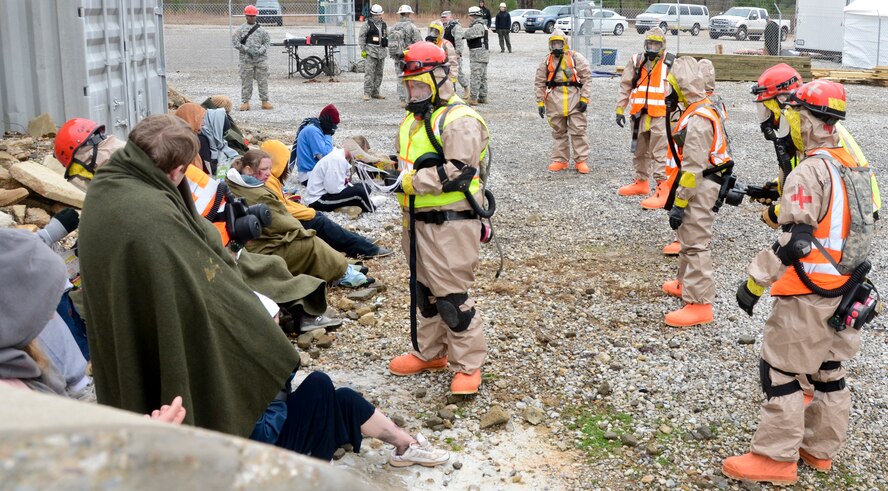 U.S. Soldiers with the U.S. Army Task Force Chemical, Biological, Radiological and Nuclear (CBRN) team member, Georgia National Guard, gives instructions to simulated wounded persons during an external evaluation exercise, Pelham Range, Anniston, Ala., Dec. 10, 2013.  The Task Force CBRN is a key component of the Region 4 Homeland Response Force set up to respond to disasters in the Southeast U.S. region.  Throughout the exercise, Guardsmen responded to various scenarios that tested their ability to save lives and mitigate suffering in order to ensure their preparedness in the event of an incident or catastrophic event.  (U.S. Air National Guard photo by Tech. Sgt. Regina Young/Released)