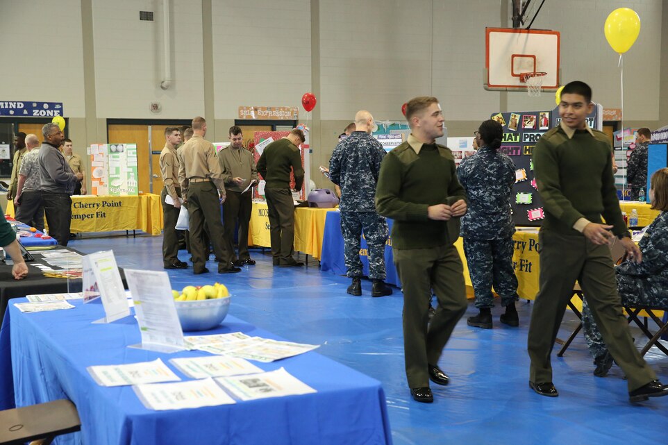 Marines, Sailors and civilians walk around to different information booths at the annual Health Fair Dec. 6 at the Cherry Tree House aboard Marine Corps Air Station Cherry Point, N.C. The Health Fair featured information booths and demonstrations to help spread awareness about habits for healthy living whether it be physical health or mental health.