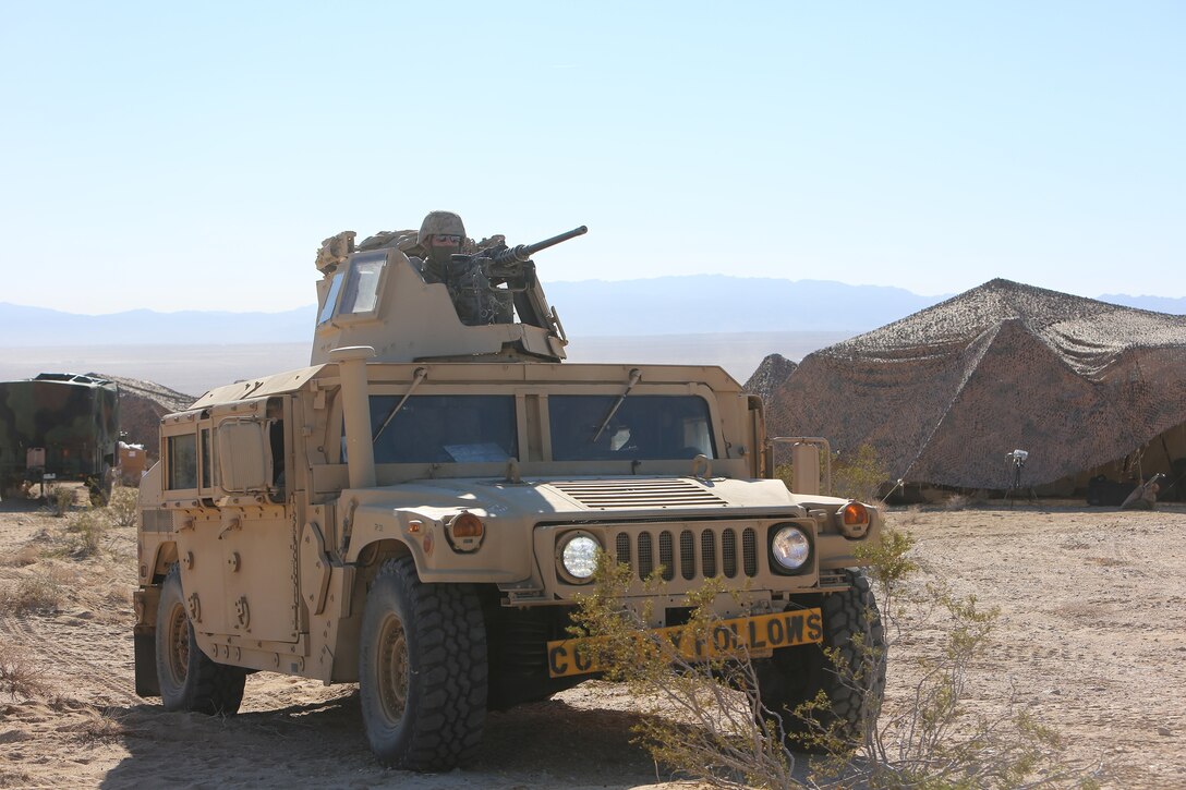 A Marine with Combat Logistics Battalion 5, Combat Logistics Regiment 1, 1st Marine Logistics Group, mans a .50 caliber machine gun while preparing to depart for a tactical convoy as part of training leading up to Exercise Steel Knight 2014 aboard Marine Air Ground Combat Center Twentynine Palms, Calif., Dec. 6, 2013. The training provided the Marines of CLB-5 with experience on what to expect when they are deployed to expeditionary environments and how to support forward-deployed units such as the 1st Marine Division.