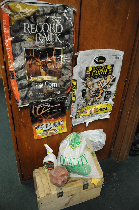 In Quantico’s game checking station, conservation law enforcement officers have a collection of deer bait they’ve found in the woods or confiscated from hunters, including bags of “deer corn,” spray-on deer attractant and a mineral block disguised as a rock. 