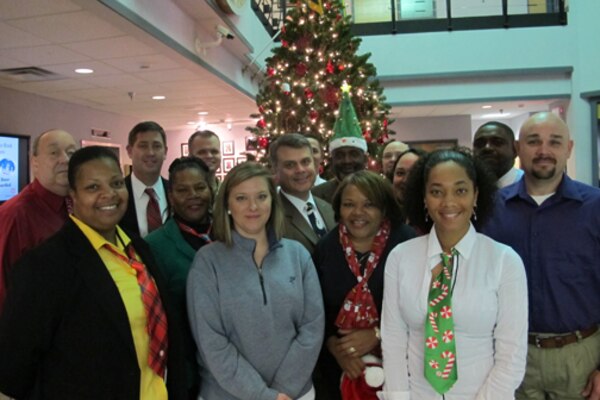 Members of Huntsville Center’s Installation Support and Programs Management Directorate’s Facilities Division wear festive clothing Dec. 10 at Huntsville Center. The team is celebrating “The 12 Days of Christmas” at the center Dec. 9-20 to reduce stress in the workplace this holiday season.