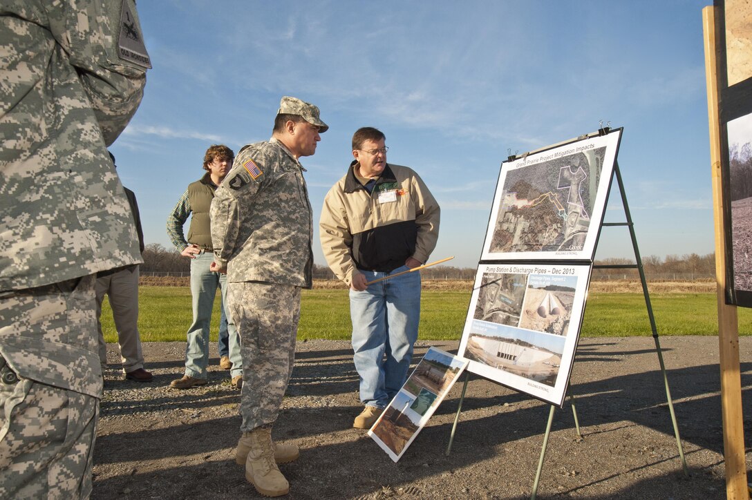 During his visit to USACE Memphis District Dec. 11, USACE Mississippi Valley Division Commander Brig. Gen. Pete DeLuca (center) receives an overview of ongoing work at the Grand Prairie project at DeValls Bluff, Ark., by Memphis District’s Loy Hamilton (far right). (USACE Photo/Brenda Beasley)