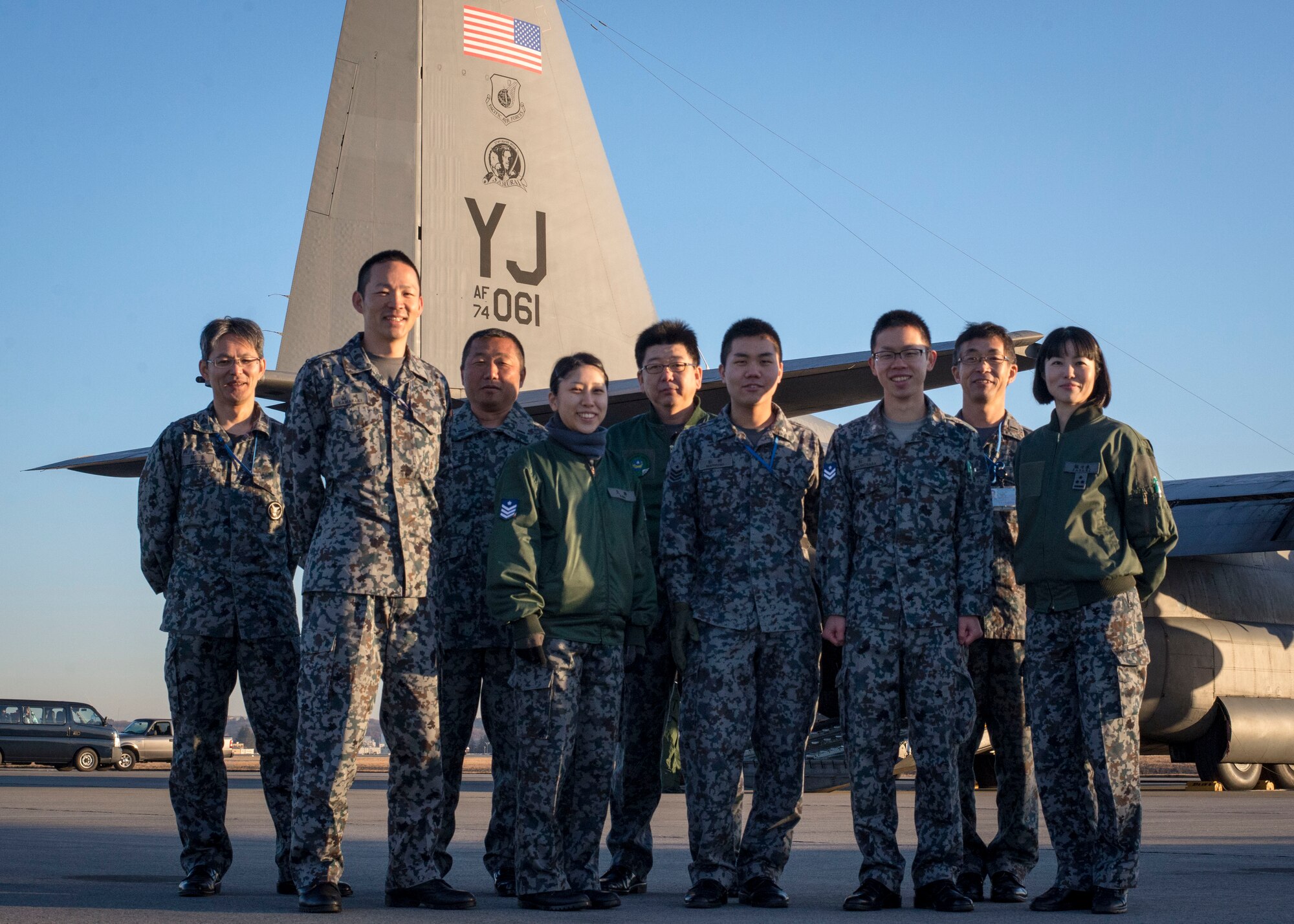 A team of Japanese Airmen after helping load several boxes of donated goods aboard a U.S. C-130 Hercules at Yokota Air Base, Japan, Dec. 13, 2013. The Japan Air Self Defense Force provided the goods as a show of good faith and partnership with the U.S. Air Force during this year’s Operation Christmas Drop. (U.S. Air Force photo by Captain Raymond Geoffroy/Released)