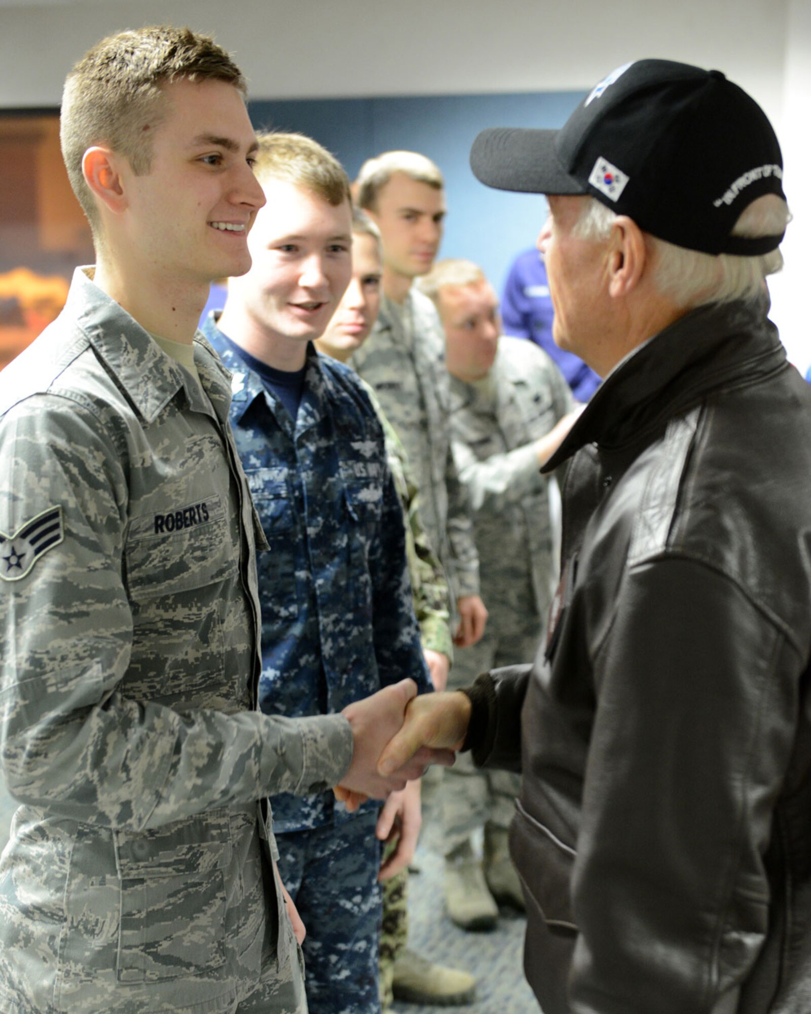 Vice President Joe Biden shakes hands with Senior Airman Evan Roberts, 381st Intelligence Squadron, during a meet-and-greet at the Joint Base Elmendorf-Richardson passenger terminal Dec. 7. This stop was one of several during his tour of the Pacific. (U.S. Air Force photo/Staff Sgt. Blake Mize)
