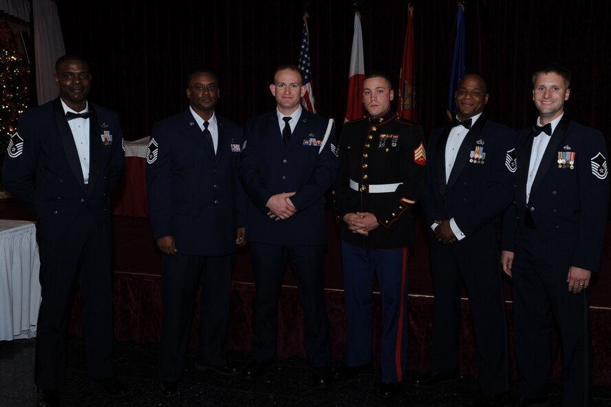 The 18th Maintenance Group provided four mentors for Airman Leadership School Class 14-A, who were recognized at the ALS Class 14-A graduation ceremony at the Rocker NCO Club on Kadena Air Base, Japan, Dec. 11, 2013. U.S. Air Force Staff Sgt. David Jones, 31st Rescue Squadron, and U.S. Marine Corps Sgt. Kenneth Richardson, Marine Wing Headquarters Squadron 1, recognized their class mentors for their sponsorship and active participation in assisting the development of Class 14-A students. (U.S. Air Force photo by Airman 1st Class Hailey Staker)