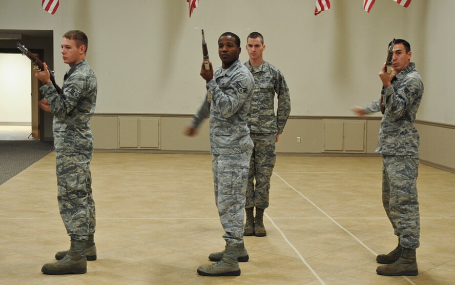 Members from the Barksdale Honor Guard practice a three-volley salute on Barksdale Air Force Base, La., Dec. 12, 2013. A three-volley salute is a tradition which dates back to the European dynastic wars where fighting ceased to collect the dead, and three shots were fired which signaled the battle could resume. (U.S. Air Force photo/Senior Airman Kristin High)