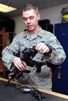 Staff Sgt. Daniel Fisher, 341st Security Forces Group Tactical Response Force Armory assistant NCO in charge, inspects the upper receiver of an M7 carbine at the Malmstrom TRF building Nov. 21. Fisher is responsible for ensuring weapon certification of all TRF armory Airmen. (U.S. Air Force photo/Senior Airman Katrina Heikkinen)