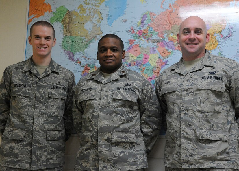 Members of the 341st Medical Support Squadron Medical Readiness Flight, Airman 1st Class Brek Halgren (left), Maj. Eric Doggett (center), and Master Sgt. Gary Cain, pose for a photo at the clinic Dec. 4. These three members along with Staff Sgt. Stephanie Breeding, not pictured, won this year’s Air Force Global Strike Command Outstanding Medical Readiness Team award.  (U.S. Air Force photo/Airman 1st Class Collin Schmidt)