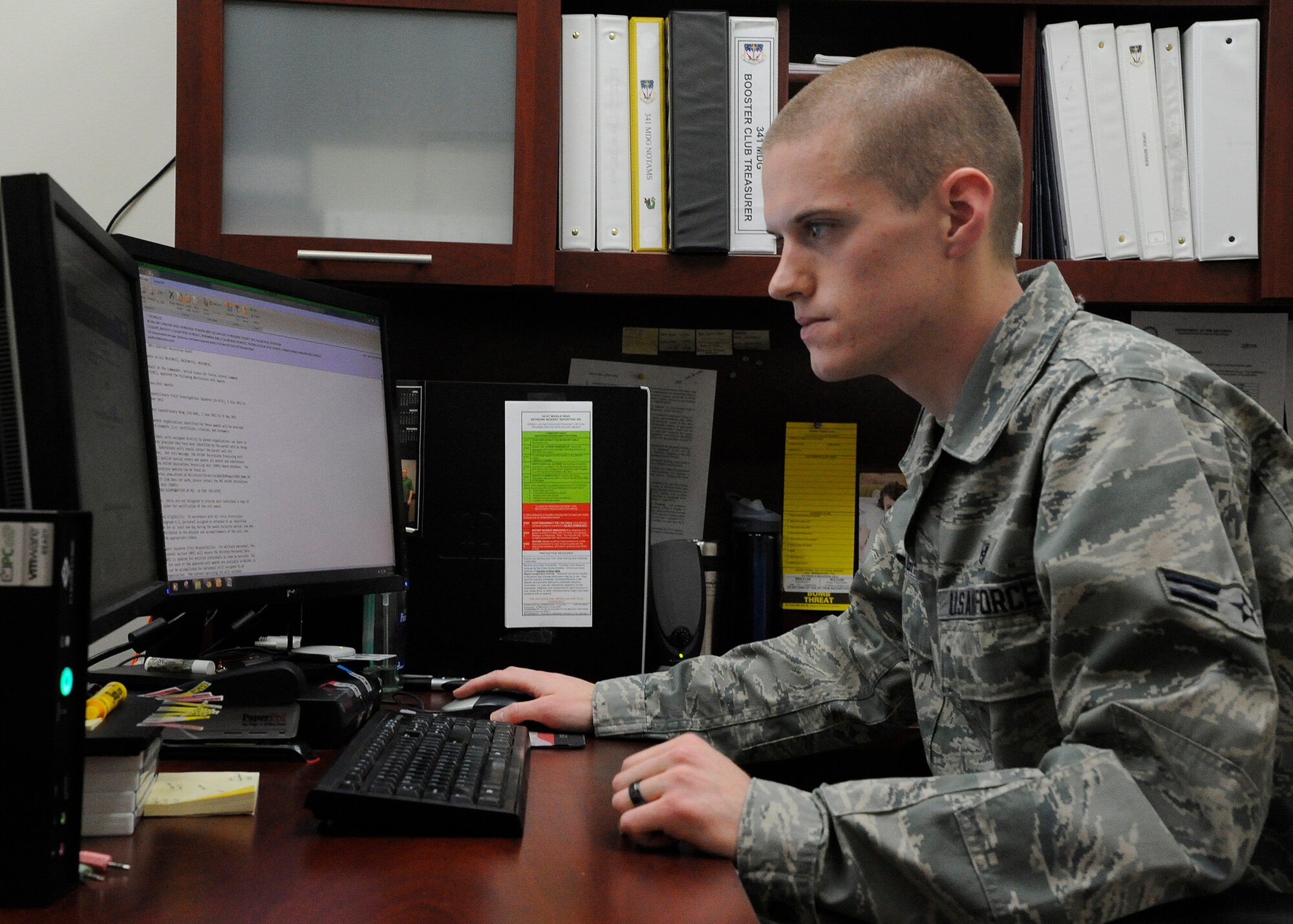 Air Force Global Strike Command’s Outstanding Enlisted Health Services Management Airman of the Year; Airman 1st Class Brek Halgren, 341st Medical Support Squadron medical readiness technician; researches information on his computer at the clinic Dec. 4. Halgren’s award was one of 13 Medical Service Awards Malmstrom Air Force base won command-wide.  (U.S. Air Force photo/Airman 1st Class Collin Schmidt)