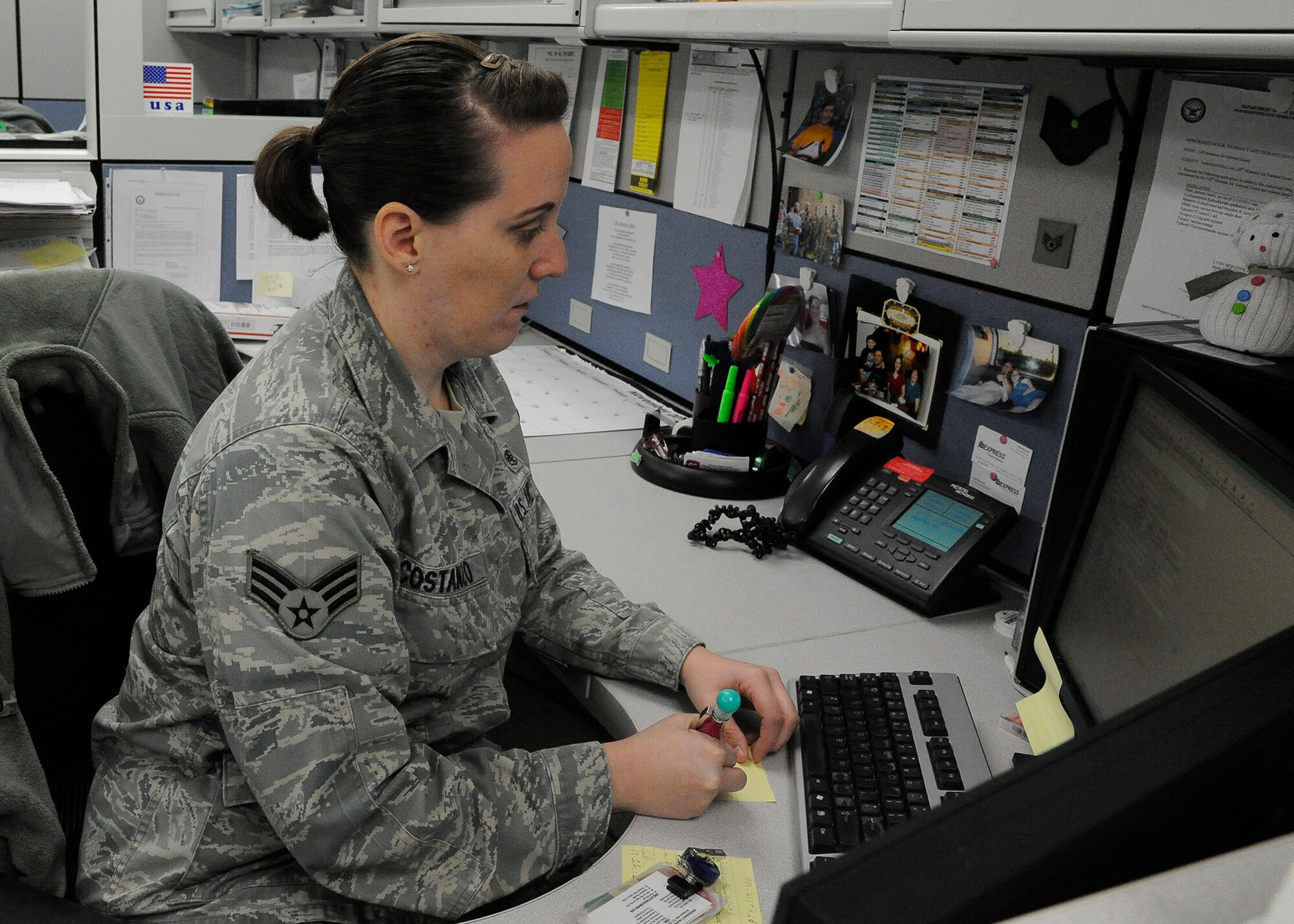 Senior Airman Jeana Costanzo, 341st Medical Support Squadron medical logistics member, takes notes from a website at the clinic Dec. 4. Costanzo was this year’s Air Force Global Strike Command Outstanding Medical Airman of the Year and will compete for the award at the Air Force level in the near future.  (U.S. Air Force photo/Airman 1st Class Collin Schmidt)