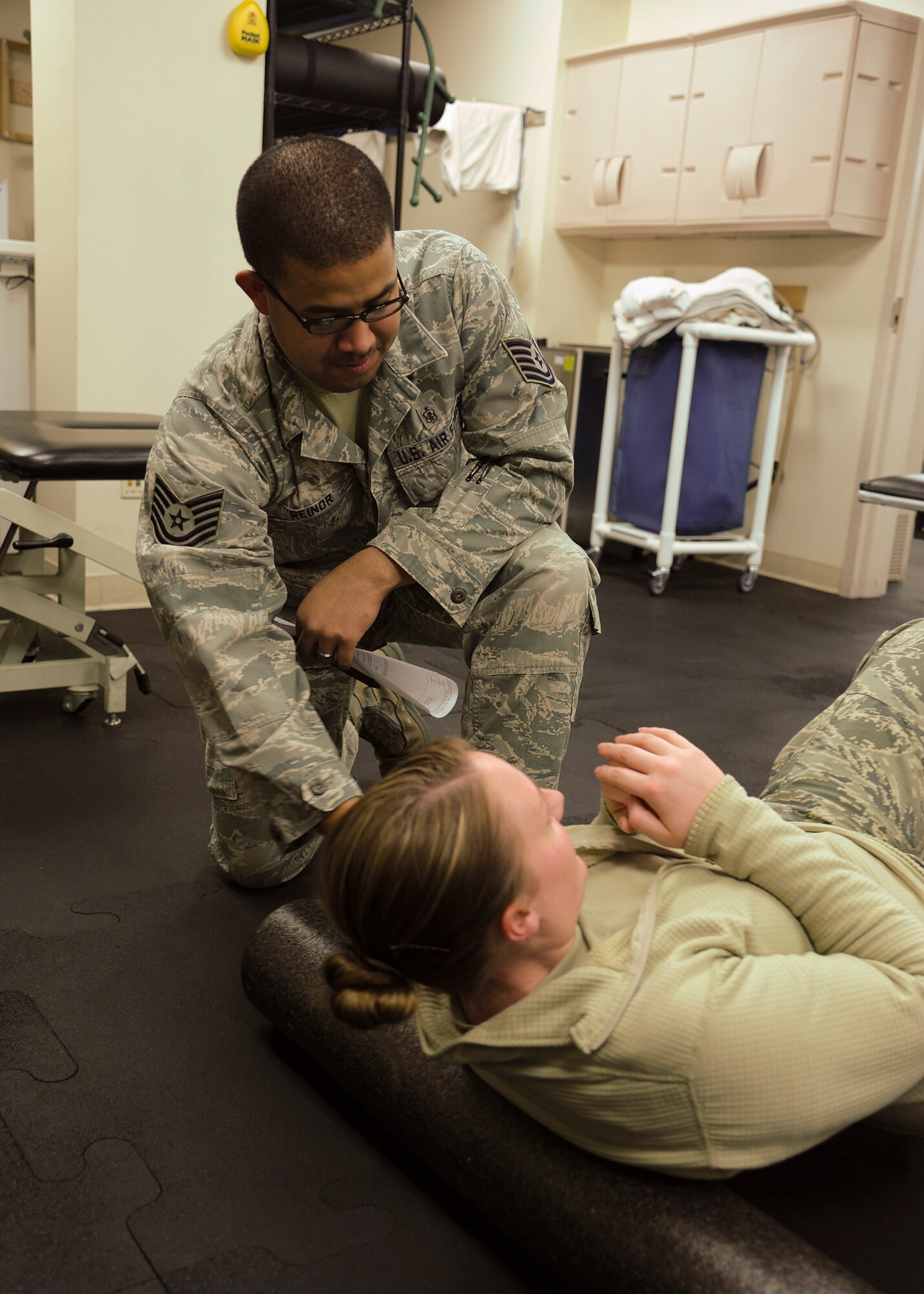 Winner of Air Force Global Strike Command’s U.S. Air Force Physical Medicine Craftsman; Tech. Sgt. Hugo Reinor, 341st Medical Support Squadron physical therapy technician; helps a patient during a physical therapy session at the clinic Dec. 3. Malmstrom Air Force Base won 13 of this year’s command-wide Medical Service Awards.  (U.S. Air Force photo/Senior Airman Cortney Paxton)