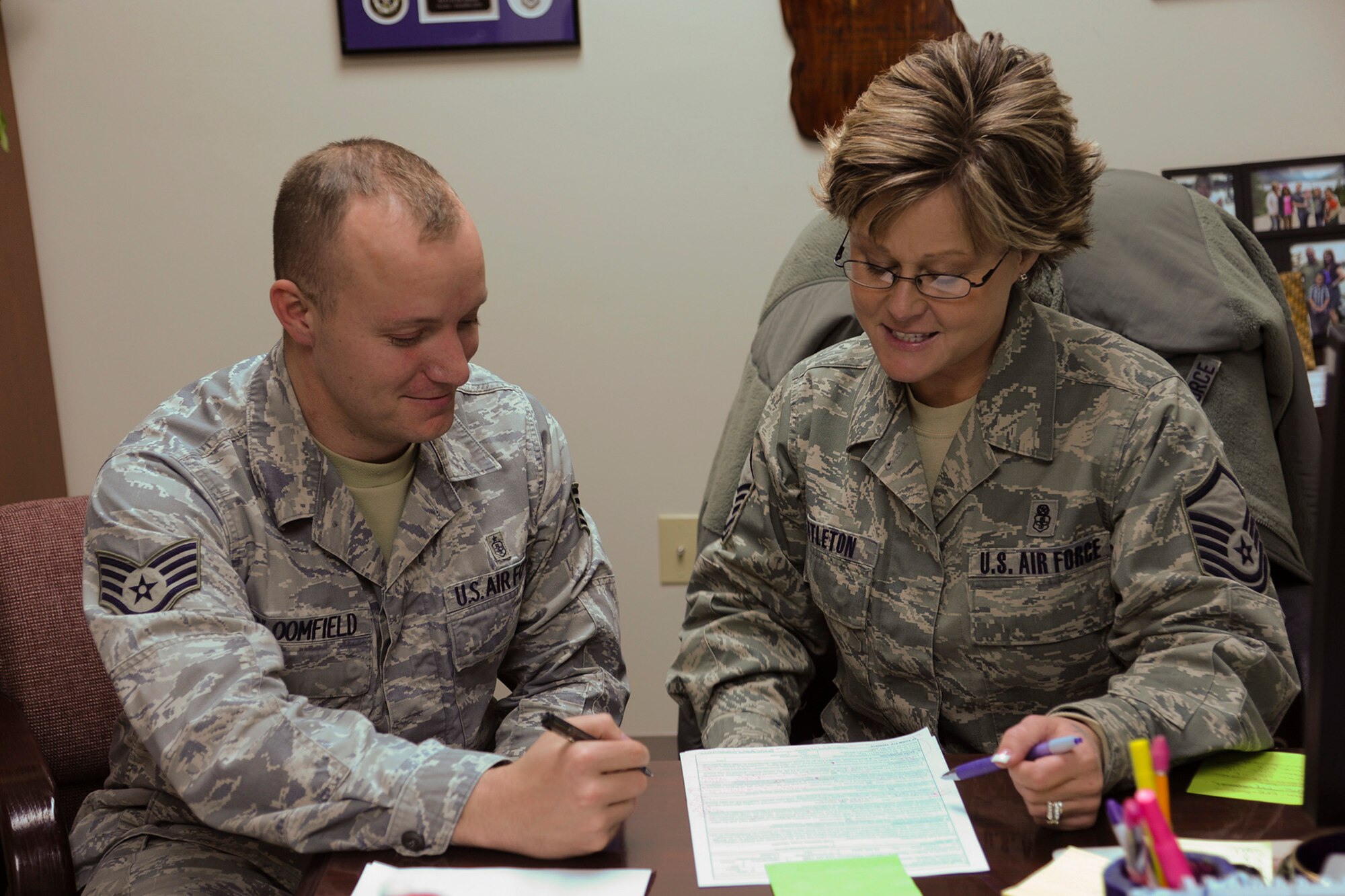 Master Sgt. Lynette Nettleton, 341st Medical Support Squadron superintendent (right), discusses an enlisted performance report with her subordinate, Staff Sgt. Justin Bloomfield, 341st MDSS medical lab technician. Nettleton received Air Force Global Strike Command’s Air Force Medical Service Senior NCO Leadership Award.  (U.S. Air Force photo/Senior Airman Cortney Paxton) 