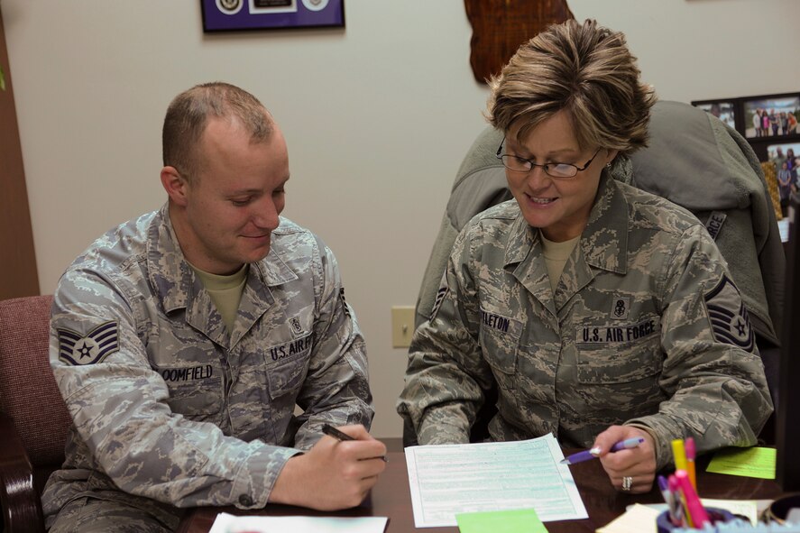 Master Sgt. Lynette Nettleton, 341st Medical Support Squadron superintendent (right), discusses an enlisted performance report with her subordinate, Staff Sgt. Justin Bloomfield, 341st MDSS medical lab technician. Nettleton received Air Force Global Strike Command’s Air Force Medical Service Senior NCO Leadership Award.  (U.S. Air Force photo/Senior Airman Cortney Paxton) 