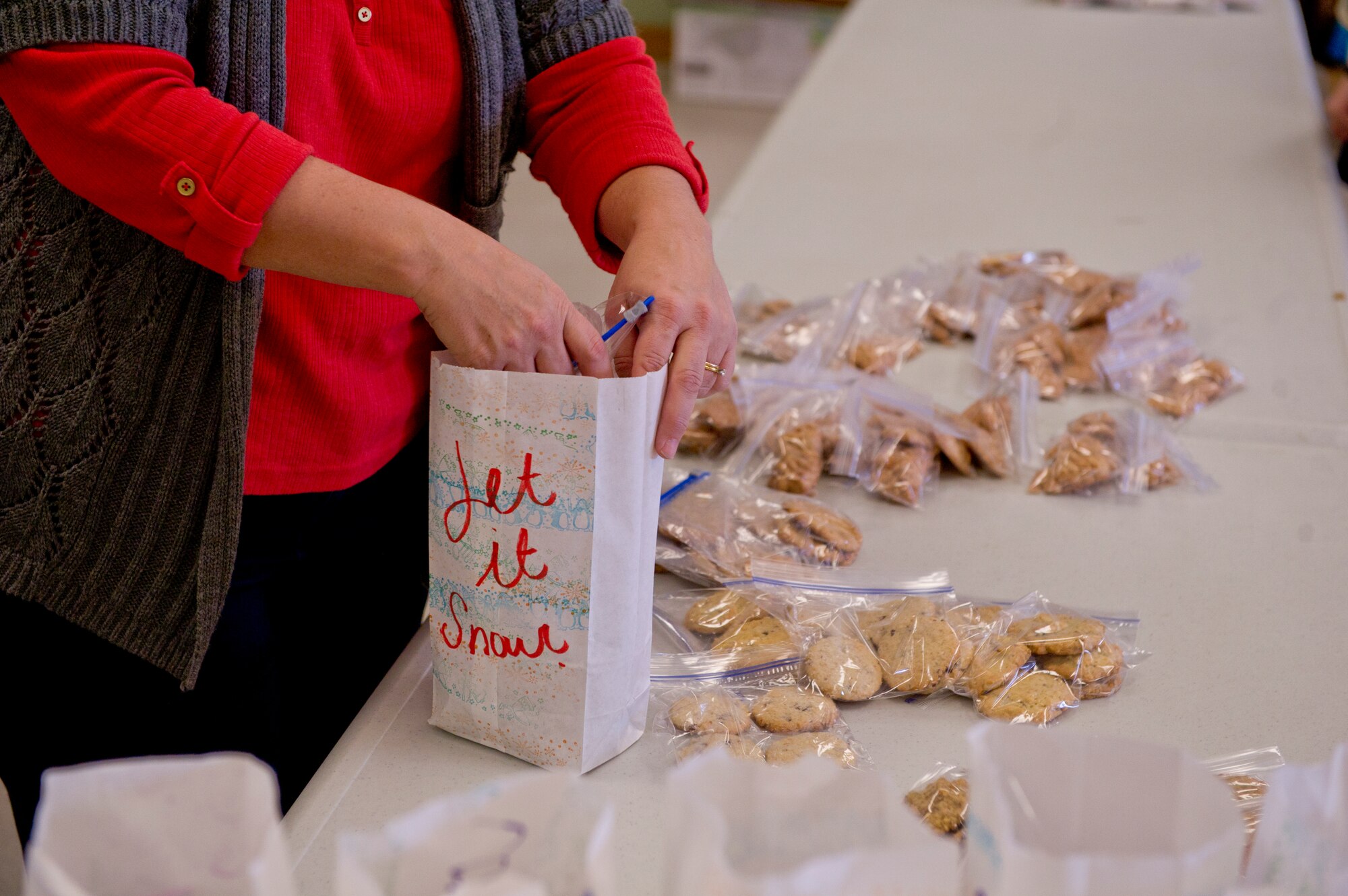Over 1,800 cookies were packaged for the 2013 annual holiday cookie drive at the Holloman Air Force Base N.M., Base Chapel, Dec. 9.  “It’s to give the Airmen who are away from home for the first time a little taste of home during the holiday season,” said Vicki Croft, wife of Col. Andrew Croft, 49th Wing commander. (U.S. Air Force photo by Airman 1st Class Chase Cannon/Released)