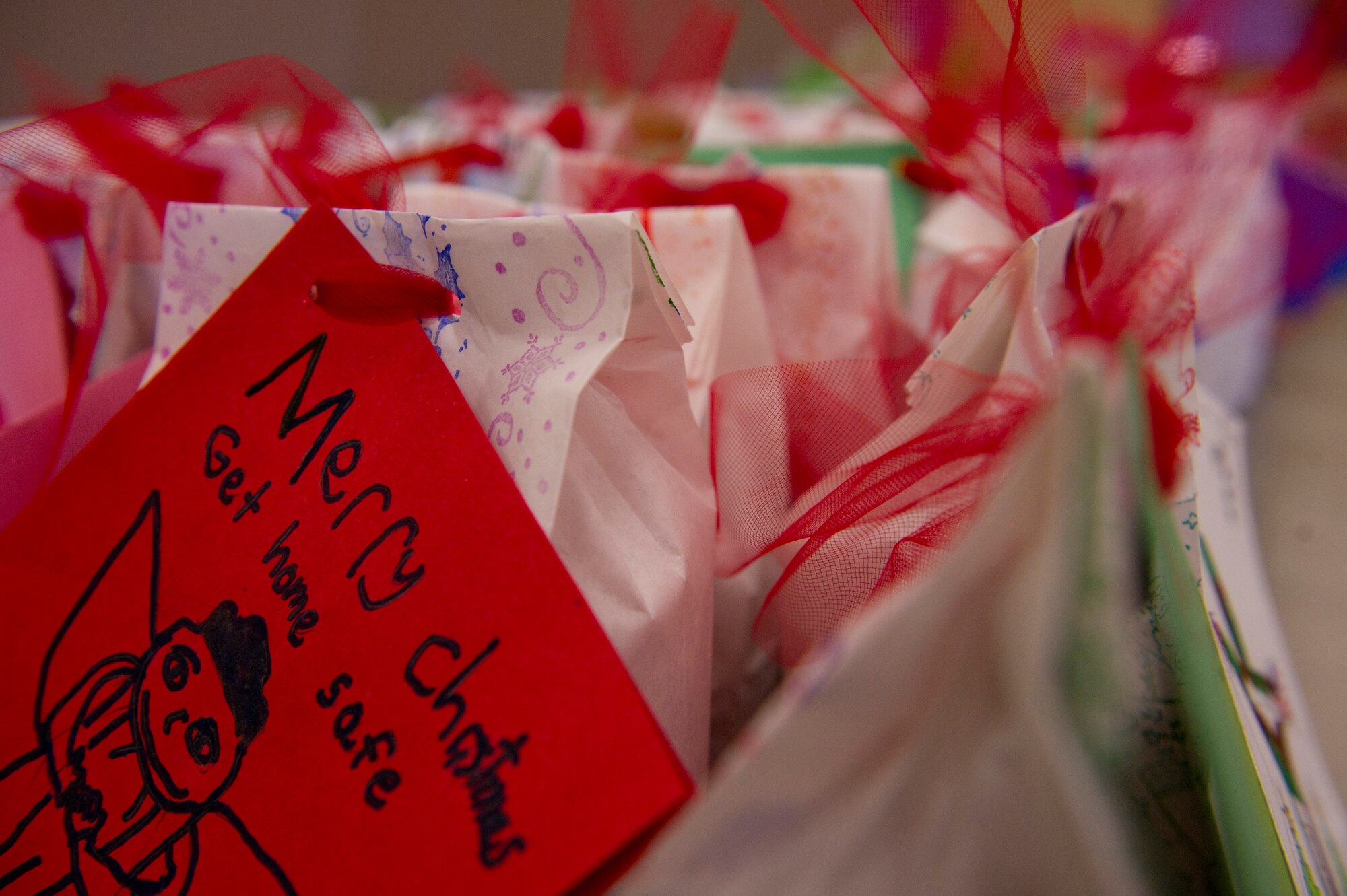 Over 1,800 cookies were packaged for the 2013 annual holiday cookie drive at the Holloman Air Force Base N.M., Base Chapel, Dec. 9. “It’s to give the Airmen who are away from home for the first time a little taste of home during the holiday season,” said Vicki Croft, wife of Col. Andrew Croft, 49th Wing commander. Members of Team Holloman and the local community baked cookies for Airmen living in the dorms to bring a little taste of home to those who might not be able to see their family over the holidays. (U.S. Air Force photo by Airman 1st Class Chase Cannon/Released)